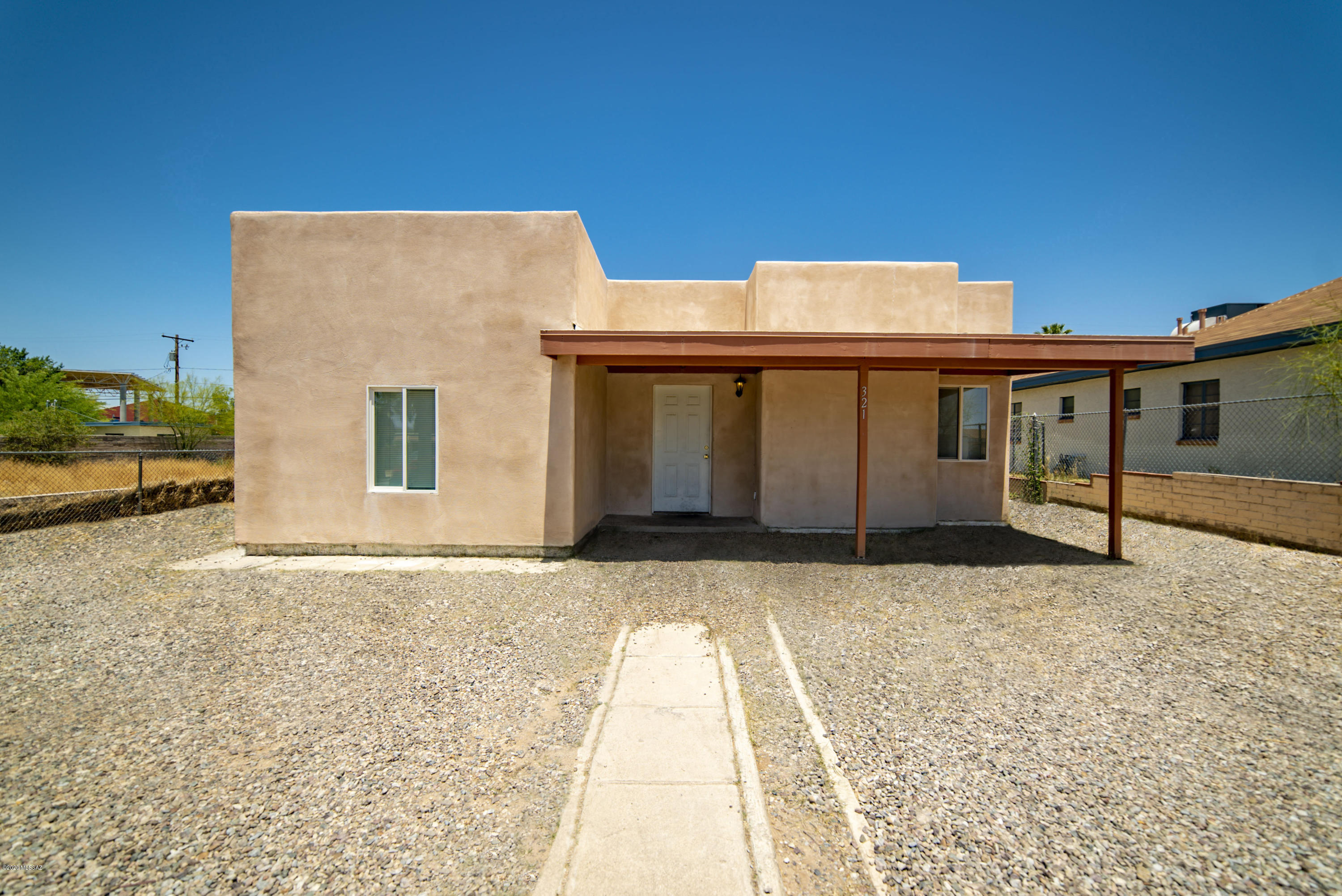 Extraordinary contemporary  style home features 5 bedrooms with 3 baths, a wood burning fireplace in the large great room with a floor plan of 1,707 SqFt built in 1948. This home is in Tucson Heights and is near 4th Avenue and the University of Arizona. Enter into the light and bright great room with wood burning fireplace and tile flooring throughout. The beautiful kitchen features with stainless steel appliances , breakfast bar, and dinning area. The 5 bedrooms are through the hallway from the great room and feature matching ceiling fans, matching tile, and great closet space. This home has recently been remodeled and updates have been made with new paint, electric, flooring, plumbing, and HVAC system. Enjoy this well designed and updated home that is perfect for entertaining the family. Outdoor living at its finest begins with the expansive private low maintenance backyard. The beautifully landscaped front and backyard is well maintained with gravel. Enjoy the being close to shopping, restaurants, 4th Avenue, and the university.