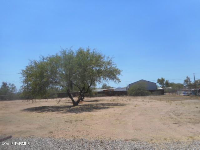 Awesome 2bd/2ba home located in Avra Valley! Beautiful fully tiled home has spacious greatroom/kitchen/dining area with shuttered sidelights, ceiling fans & garage access. 2 nice sized bedrooms. Larger bedroom has mirrored closet doors. Two baths - one is powder room off greatroom, second has bath/shower and a separate shower stall as well. HUGE yard and endless possibilities. Come see this one today!