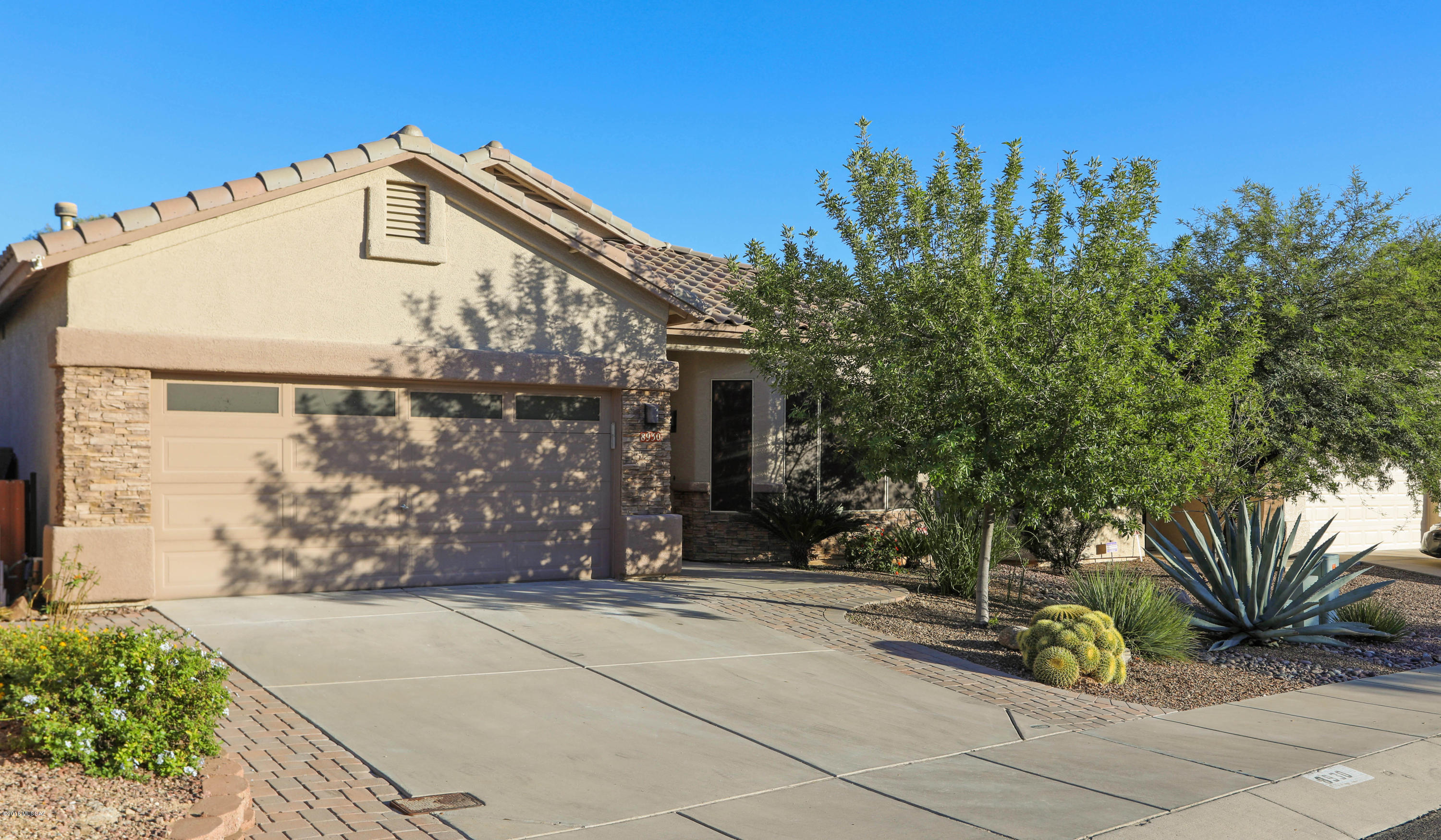 Exceptionally well-maintained three bedroom, two bath, 2,040 SF single level home situated in the desirable gated Reflections at the Bluffs community in NW Tucson awaits. Great Room floor plan has gas fireplace, new tile flooring (Oct 2018) & plantation shutters. Open kitchen boasts 42'' maple cabinets, stainless appliances, breakfast nook and pantry. Split bedroom plan. Spacious Master bedroom features large walk-in closet with organizers and plantation shutters. MB has dual sinks, garden tub and separate shower.HVAC 16 Seer, 2 Phase system (2017),  outdoor living with an east facing backyard,  Mountain views, covered patio, spacious travertine patio, fountain, lush lawn & hot tub. 2 car garage with newer garage door opener, built-in cabinets. Sellers are licensed Arizona RE agents. entry. Exterior painted (2015), interior painted (2018). Great NW location close to Omni Tucson National golf, NW Pima C.C., shopping, parks, and easy access to I-10