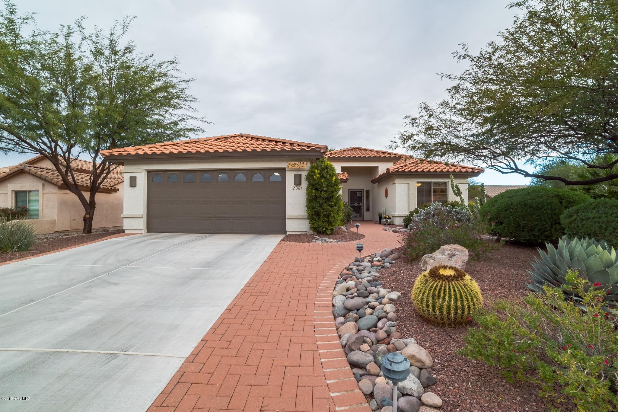 This impeccably maintained home sits on a large, walled corner lot. This home is an entertaining dream. The patio has been extended the entire width of the home and then the pergola was added. Outdoor living at it's finest with the built in BBQ and kitchen area. The kitchen features corian counters as well as 42'' Hickory cabinets. Easy care counters in both bathrooms plus the 2nd bathroom contains a Custom counter extension. The extended garage offers extra space and storage. Quail Creek is all about the active lifestyle and this home is just a few blocks from the fitness center and all the other amenities. Be sure to put this home on your list.