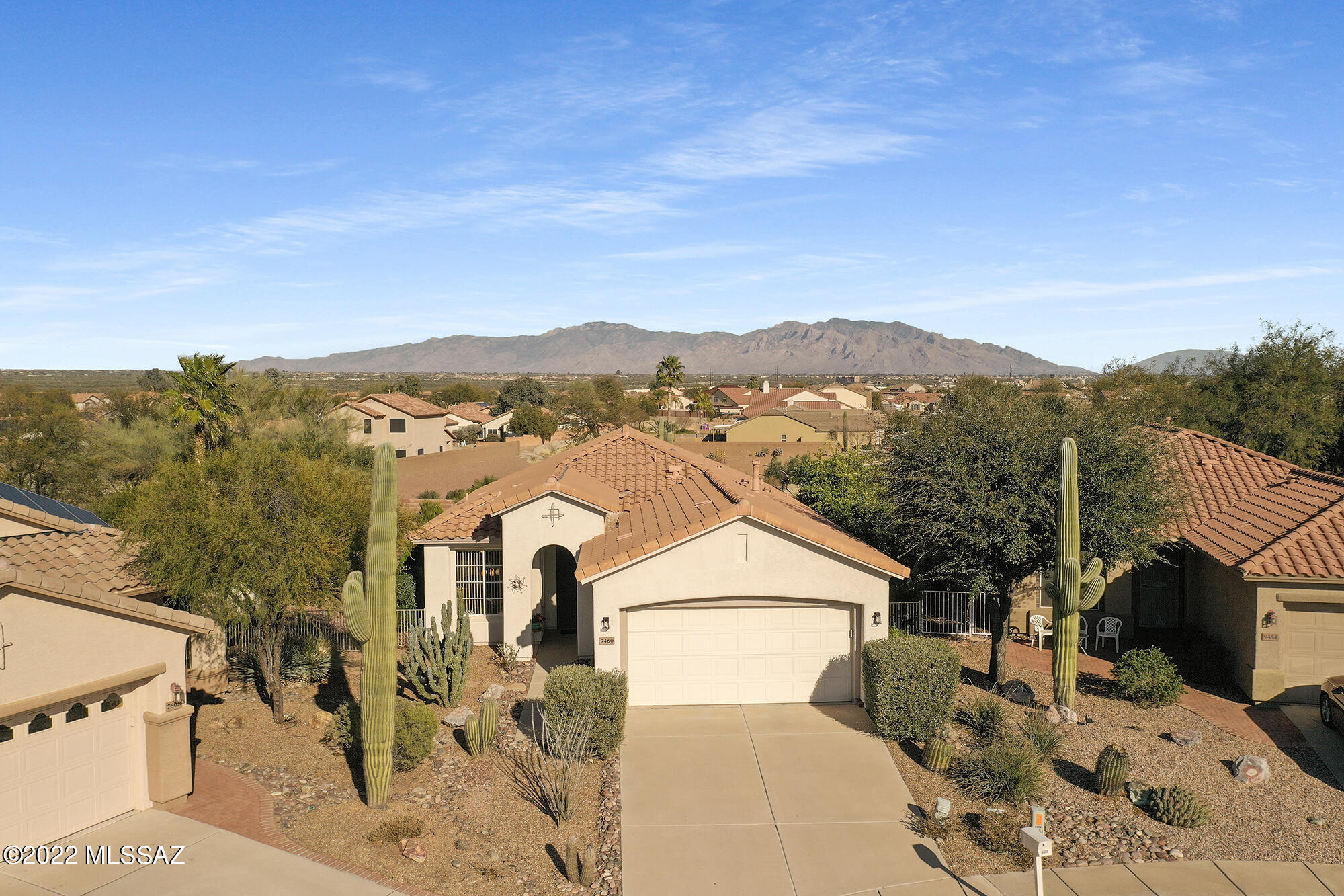 Views of the Catalina & North Tucson Mountains along with being in an active adult community...what more can one ask for! Enter through the stately portico &  into this Sierra model which hosts 2Bdrms/2Baths, Great Room with a formal dining area & Bistro Kitchen. Enjoy your coffee in the Breakfast Nook as you view the mountains. Primary Bedroom is replete with a bay window, two closets and the en-suite has a spacious shower. Guest Bdrm and Guest Bath will welcome your company. Relax in the Great Room as you view the picturesque ''Botanical'' back yard with native plants & an Arizona Sweet Orange, Tangelo & Lemon tree with the Catalina Mountains in view. The fragrance of orange blossoms will soon be filling the air around this intriguing home. Seller will entertain offers $315,000-$325,000.