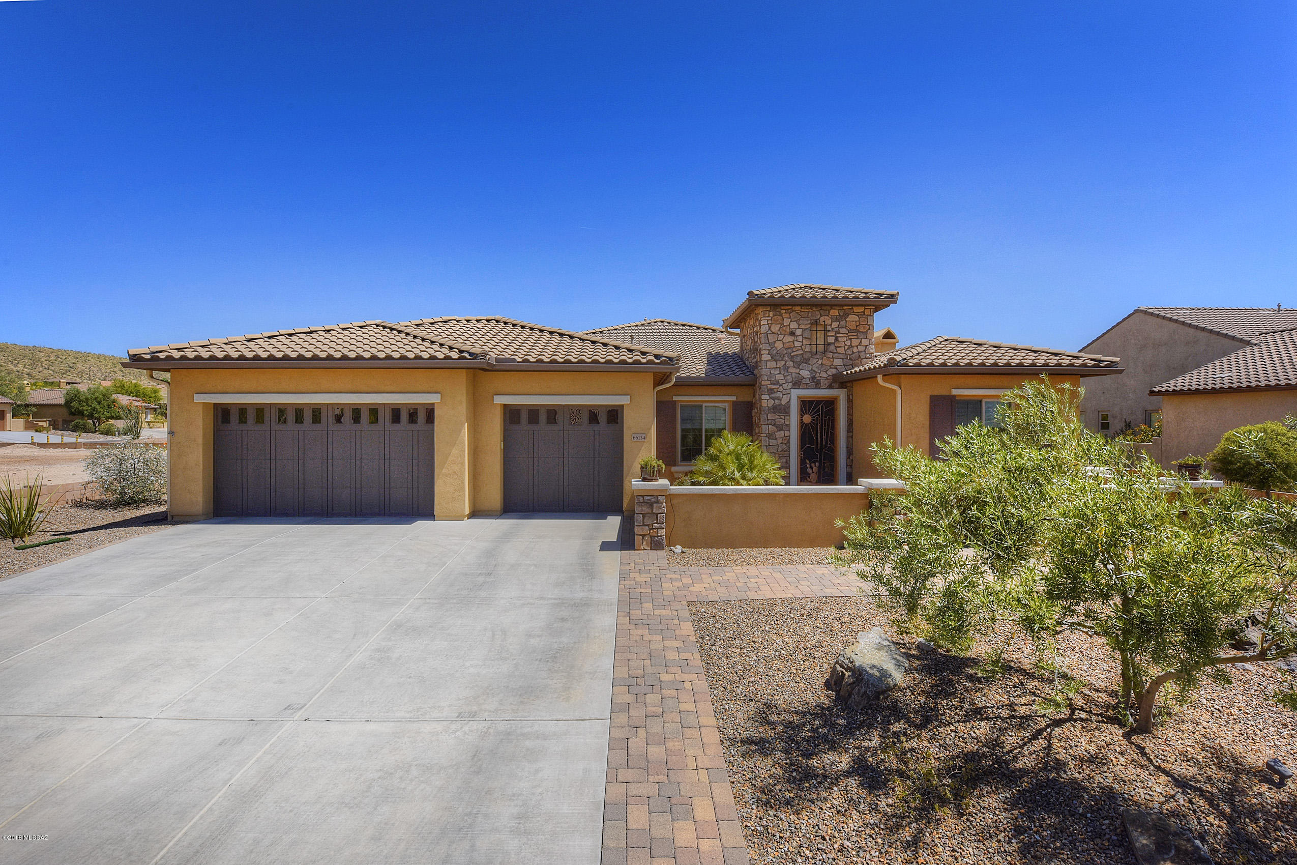 Welcome to the Preserve of SaddleBrooke & this fantastic model of the Canyon. This home shows like a model & is move-in
ready w/many upgrades. Kitchen has 42 inch, staggered height alder cabinets, granite counters, S/S appliances including gas cooktop, as well as tumbled marble backsplash & pendant lighting over large island.  Crown molding, 20'' porcelain tile along w/wood look tile in the bedrooms, custom window treatments & office w/customized built in granite-topped furniture. There are 2 fireplaces â“ great room & patio. Master bath has double vanities & large shower. Guest bed has a private bath & there is a 3rd bedroom too! A full 3-car garage w/extra storage. Walk outside to a serene oasis w/a terrific pool w/waterfall & low-care professional landscaping. Vacation from home!