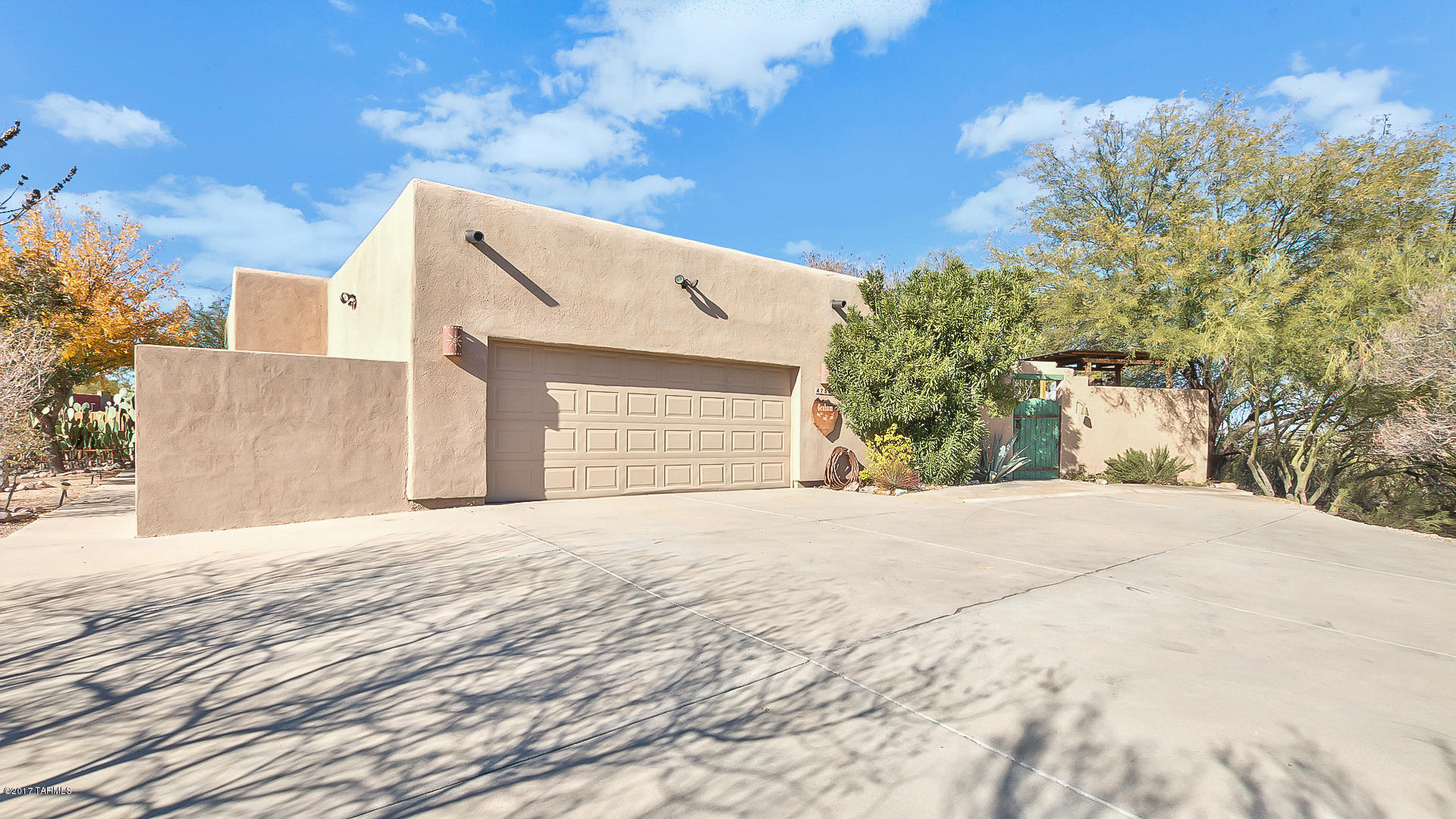 Gorgeous custom 4 bedrm & 2.5 ba, Santa Fe style home on over 3.6 acres! Walk in through a beautiful courtyard entry with lush landscaping, a fountain and gardens. New gazebo, & more!! Large kitchen w/island, includes viking dishwasher & upgraded appliances. Master suite-includes large closet, an additional seating area with closet. Separate shower & jacuzzi tub & a 6 x 15 walk in safe secured by solid steel, double bank vault door. Open living area w/french doors to the quiet patio, with catcus garden & a pond.  Plantation shutters throughout the home. Work shop added in 2010 approx. 600 sq. ft. has garage door, and easily converted into a guest house/casita with easy access to water and electric. City & mountain views and easy access to 1-10 freeway.