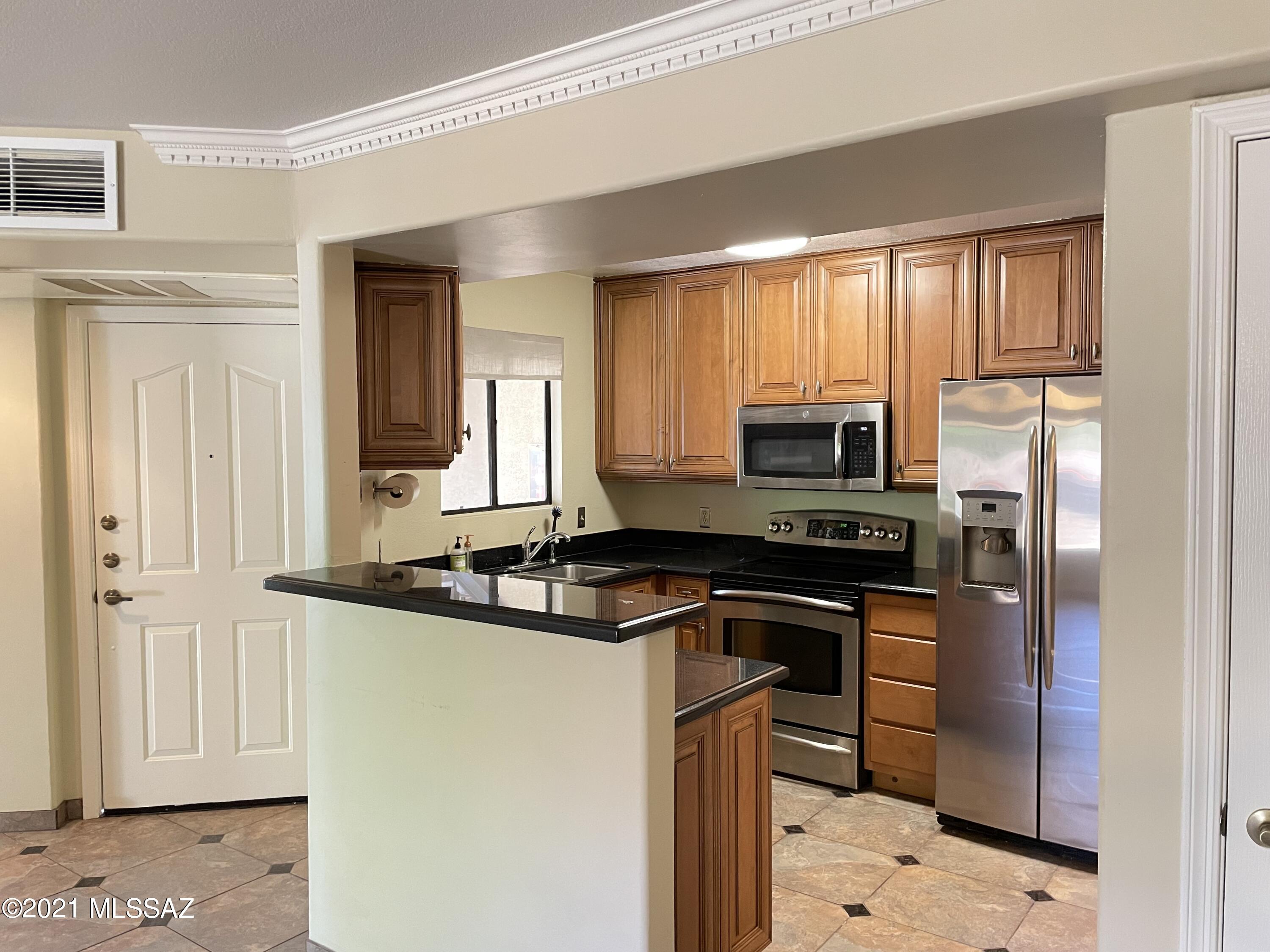 Sweet, Stylish on the first Floor!! Great location close to the both pools, fitness center and clubhouse. Upgraded kitchen with Galaxy Granite countertops, stainless steel appliances, and custom Cabinetry. Tile and luxury plank flooring everywhere-NO CARPET! Awesome private balcony with peeks of the mountains and treetops. Veranda at Ventana is within minutes  to a grocery store, 5 restaurants, a salon, CVS, UPS store, post office, +++! The community features 2 resort style pools complete with water features and spas, a fitness center, 8 Ramada's throughout property with natural gas grills and picnic tables to enjoy a BBQ! 24 hour Gated access. Tenant occupied until 8/31