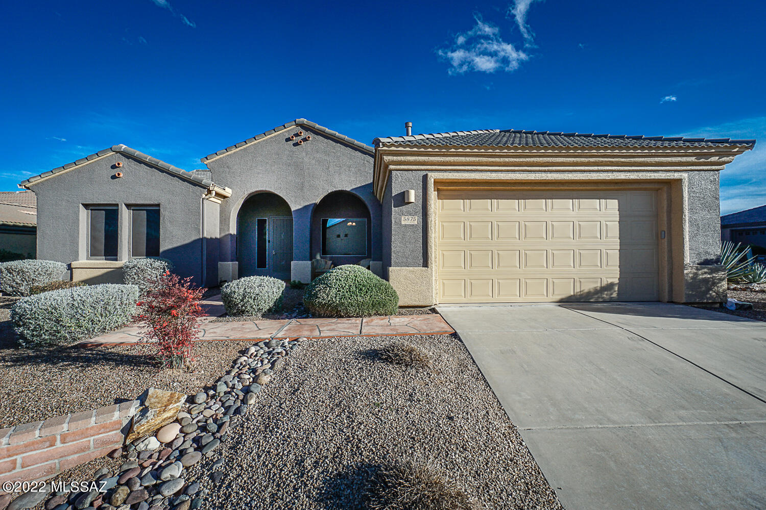 This house sits on an elevated corner lot in the gated community of Canoa Ranch and offers so much!  The home has been newly painted inside with new carpet in the formal dining living room and all three bedrooms. New epoxy in the garage.  On the outside, the mountain views are the backdrop to the mature landscaping, just newly manicured. You'll love the space this home has to offer with an open kitchen, breakfast nook, and family room with views of the Santa Ritas.  A beehive fireplace will add coziness to a gathering or just to snuggle up with a book on a chilly afternoon. And did I mention the secluded backyard that offers ultimate privacy?  You aren't going to want to miss out on the spectacular offerings this house has will provide the lucky next homeowner!