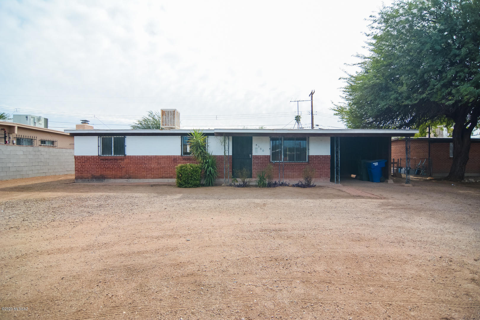 Vacant, sanitized brick construction home. Save thousands on this fix up home. Great Central Tucson location. Three bedroom and two bathrooms, a rare floorplan to this neighborhood. One car carport. On a large lot.