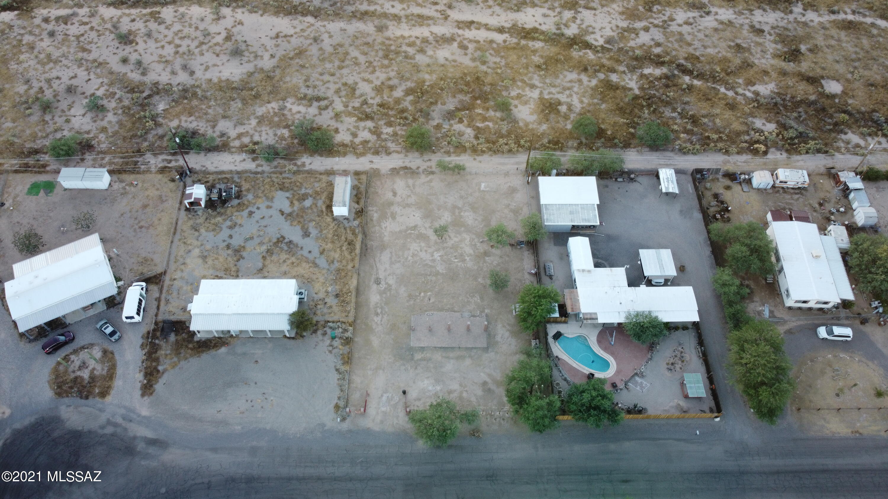 Great opportunity off of Twin Peaks and I-10.  City sewer, electric, water and gas available on site. Backs the Los Morteros conservation area followed by beautiful mountain views. Fenced all around with custom front fence. Five minutes from I-10, Tucson Premium Outlets and close to Marana commerce. Room for a RV hookup on the property. Quite neighborhood. TH zoning allows for mobile homes or even to build your own home!