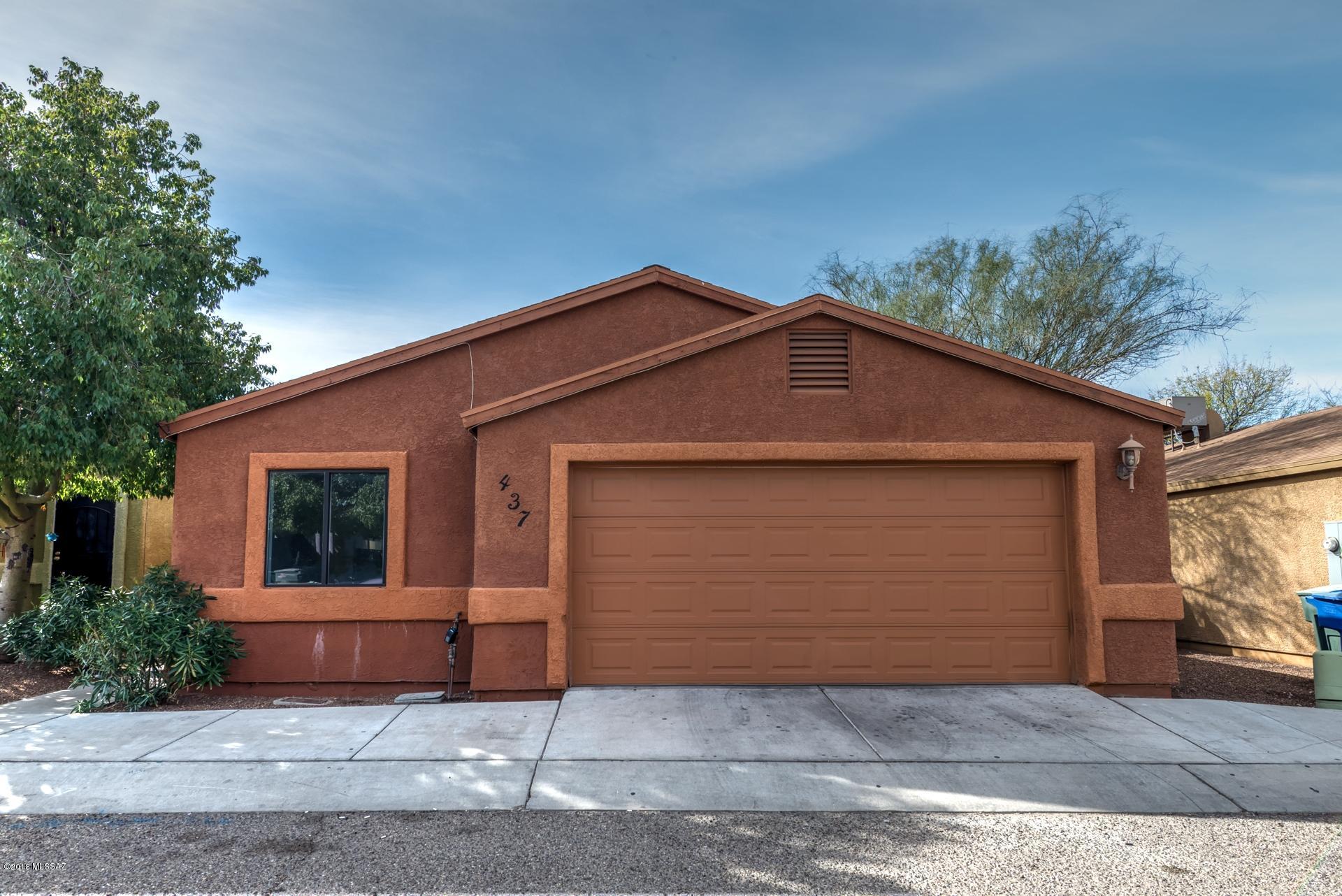 Freshly painted and professionally cleaned, just minutes from the UofA! Single story 4 bedroom 2 bath plus a two car garage. Wide open layout with vaulted ceilings, painted concrete floors and gas fireplace. 3 of the 4 bedrooms have walk in closets and there is a laundry room as well. Good sized yard with low keep landscaping. Has been a rental with past rents as high as $1600 per month.