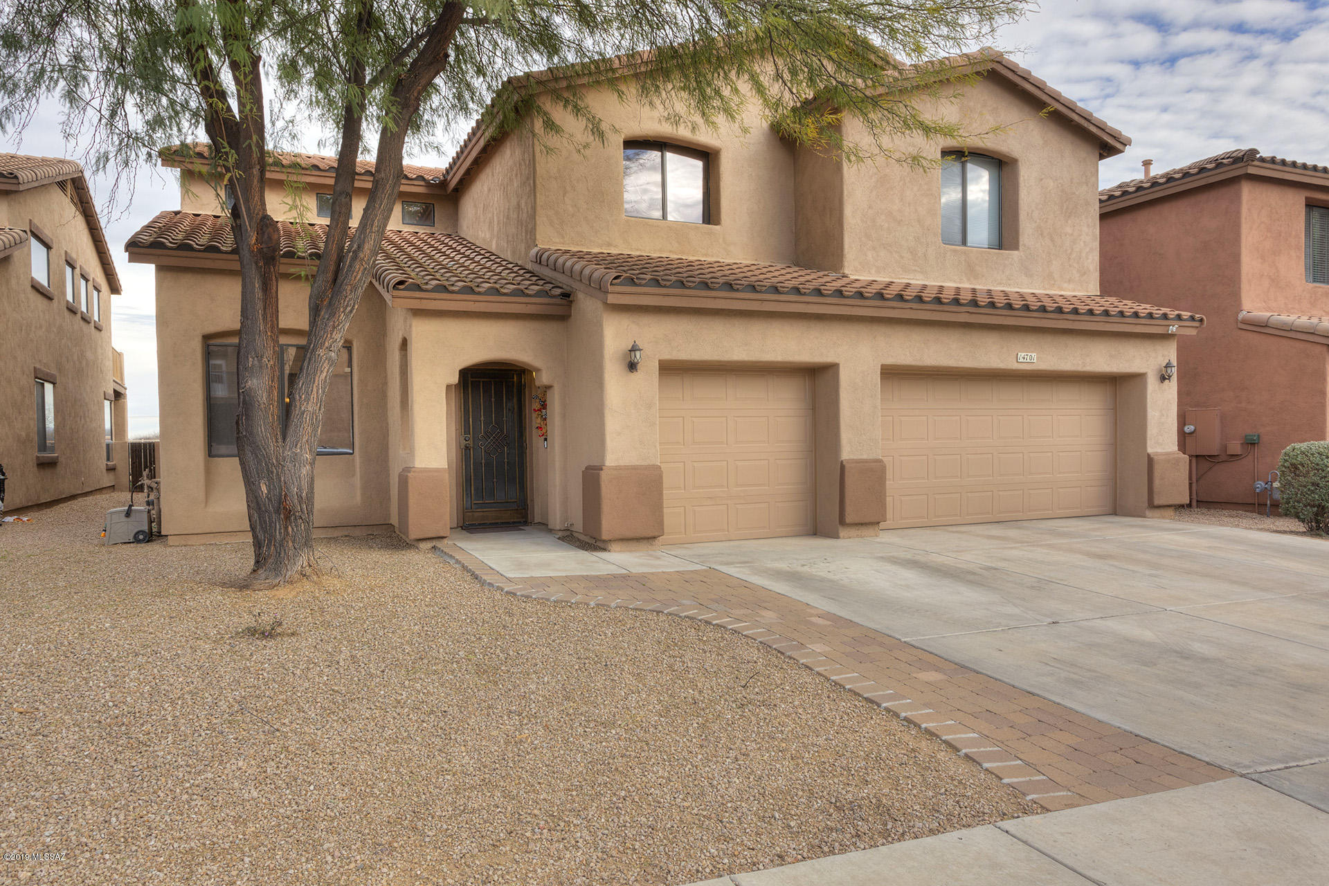 Fabulous Rancho Sahuarita location & a flawless home that is sure to impress! Situated on a premium lot with NO REAR NEIGHBORS, features include clear mountain views,5 bedrooms & a 3 CAR GARAGE. Huge kitchen w/island, tons of cabinets & stainless appliances. Front formal living/dining room; family room w/corner beehive fireplace, ceramic tile floors, custom interior paint. Unique loft & spacious bedrooms upstairs. Enormous master suite downstairs w/spa-like bathroom & a private door to the back patio that overlooks the incredible Sahuarita Pecan Groves & the Santa Rita mountains. Backyard also features a water fountain, outdoor kitchen, view fence & a TV (YES IT''S INCLUDED!)...perfect for entertaining, stargazing, or relaxing. Fully finished 3 car garage with epoxy floor and custom cabinets. You can no longer find lots like this to build on in Rancho...so here's your chance to own the home of your dreams!