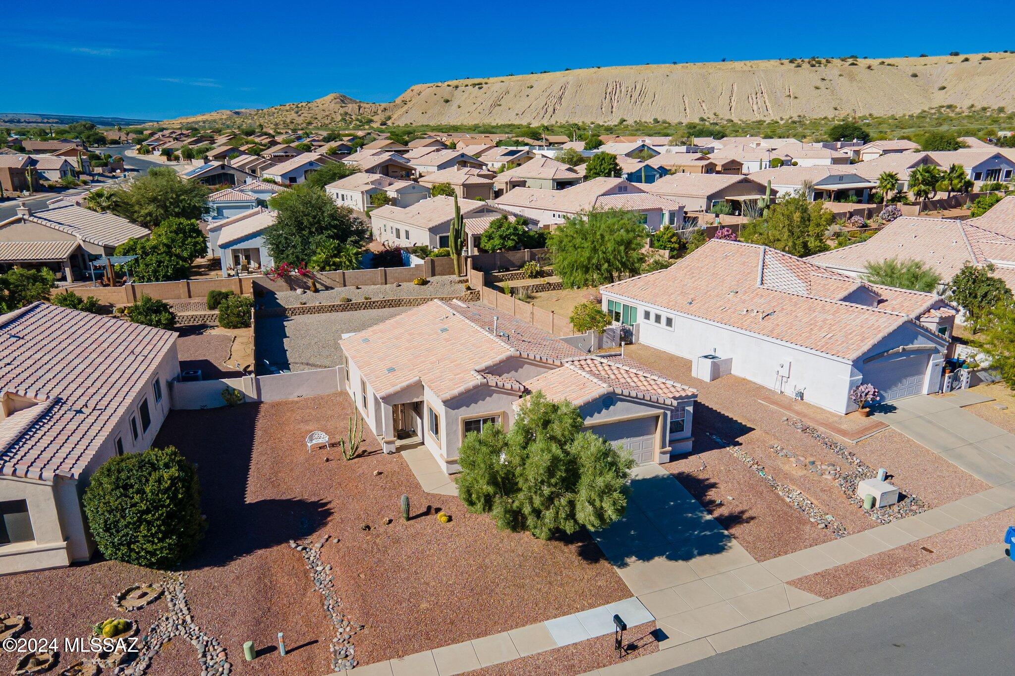 Imagine mornings with warm sunlight filling your cozy kitchen and days spent exploring nearby shops, trails, and the golf course. Located across from the temple, this 3-bedroom, turn-key gem in Green Valley offers low Pima County taxes and a peaceful 55+ community with everything at your fingertips.''

''Enjoy weekends in your private, enclosed backyard—perfect for a garden retreat—and afternoons with friends in the spacious two-car garage workshop. Move right in with the option for fully furnished living and settle into a lifestyle of convenience, comfort, and charm. Ready to start living the life? This home awaits.