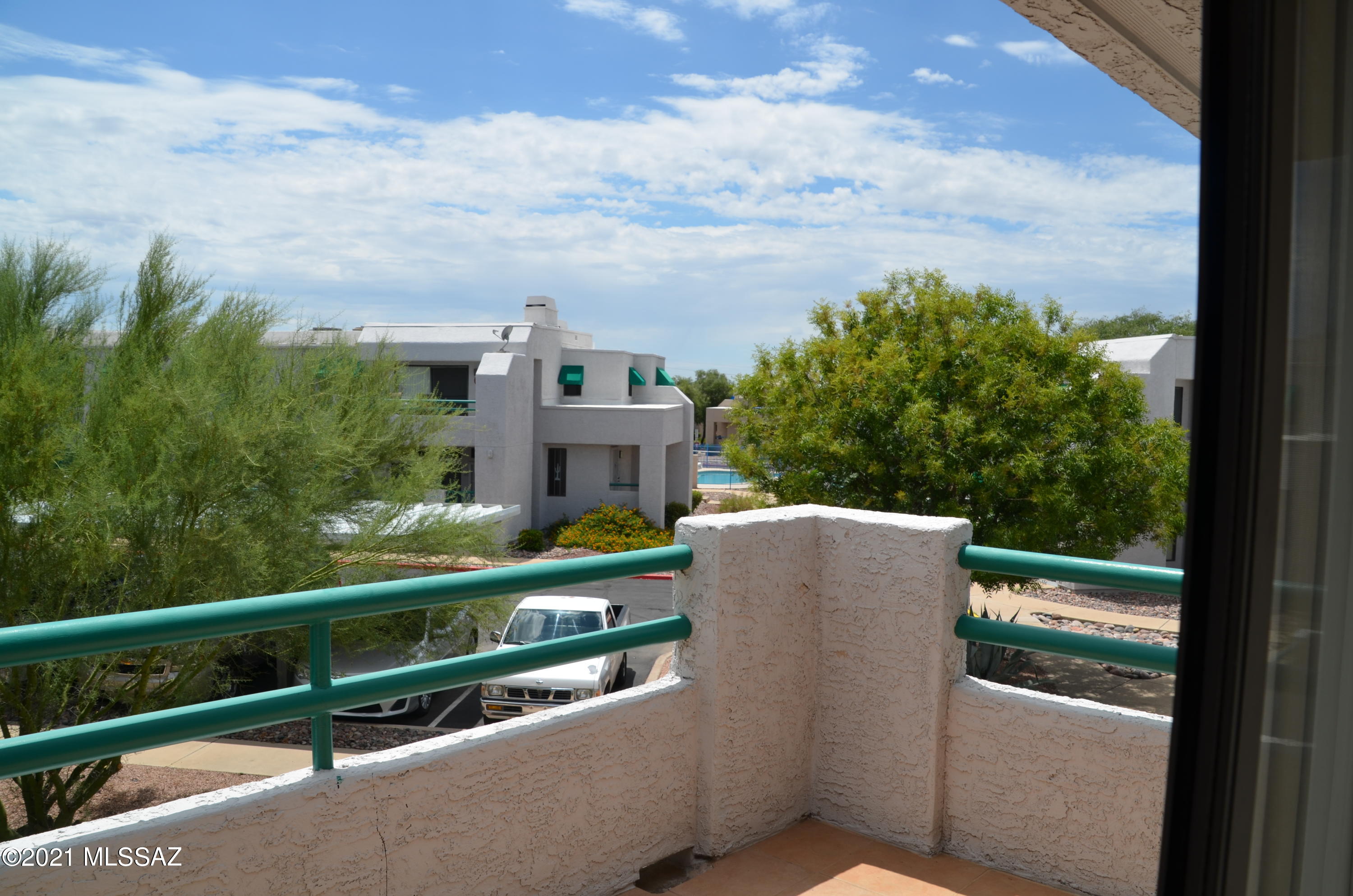 Super sweet Summertree Condo. Bright and light 2 Bed/ 2 Bath 1145 Sq Ft. unit. Easy access to both pools. Tile throughout except bedrooms. 1 covered parking space included. HOA includes 2 pools, spas, exterior maintenance, water and trash. EZ lock and go.