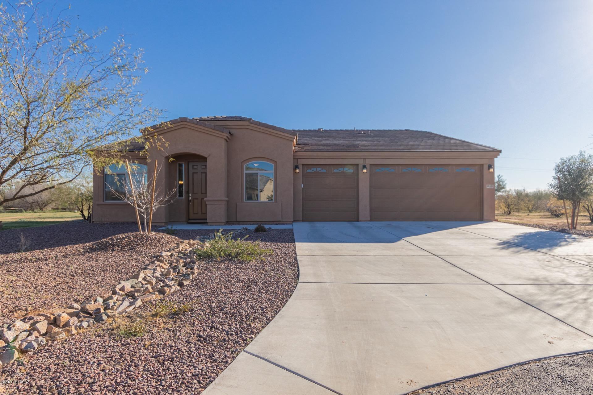 Gorgeous 4 bed/3 bath home available on nearly an acre of property in NW Tucson. Situated on a quiet cul-de-sac in the excellent gated community of Tierra Linda Nueva. Beautiful inside and out, this incredible home offers a spacious formal living room as well as a separate open concept family room. Kitchen will delight any chef with SS appliances, granite counter tops, a pantry and a massive island with breakfast bar seating. Soft plush carpet and tile in all of the right places. Inviting master retreat boasts a walk-in closet and a private en-suite with dual sinks. Sprawling backyard offers more than enough room for entertaining and even a pool. Savor sweeping views from the privacy of your own covered patio. Seller to entertain/counter offers between $395,000 - $405,000.