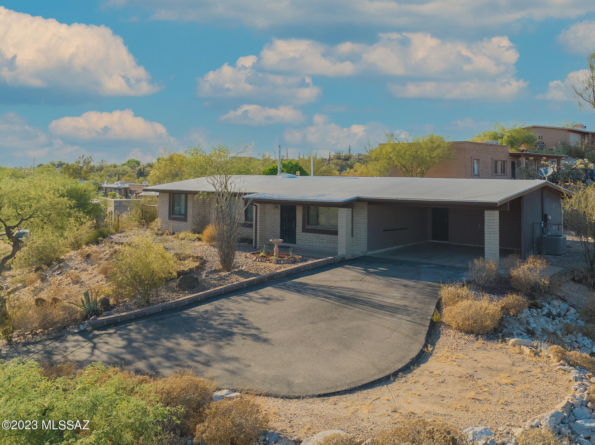 This move-in ready home in Northwest Tucson offers a a large corner lot with no HOA & room for parking an RV. Updates throughout include plank flooring and a newly renovated kitchen with quartz countertops. A lovingly maintained residence situated beautifully for mountain ridge views to the south. The primary bedroom has en-suite bathroom with walk-in shower. Two additional spacious bedrooms and generous second bathroom. Enjoy the shade of the screened porch and ample storage in the oversized laundry room and storage shed. Just minutes to Northwest Medical Center, shopping, and restaurants. 2017 gas HVAC installation and 2018 water heater (also gas).
