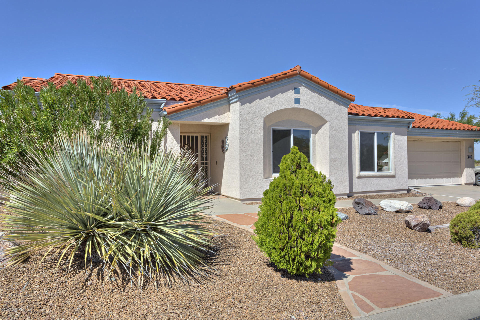 Back patio sits high over the 9th tee box with some mountain views. Family room off kitchen, good size living room with dining area. New roof, good size garage with cabinets.