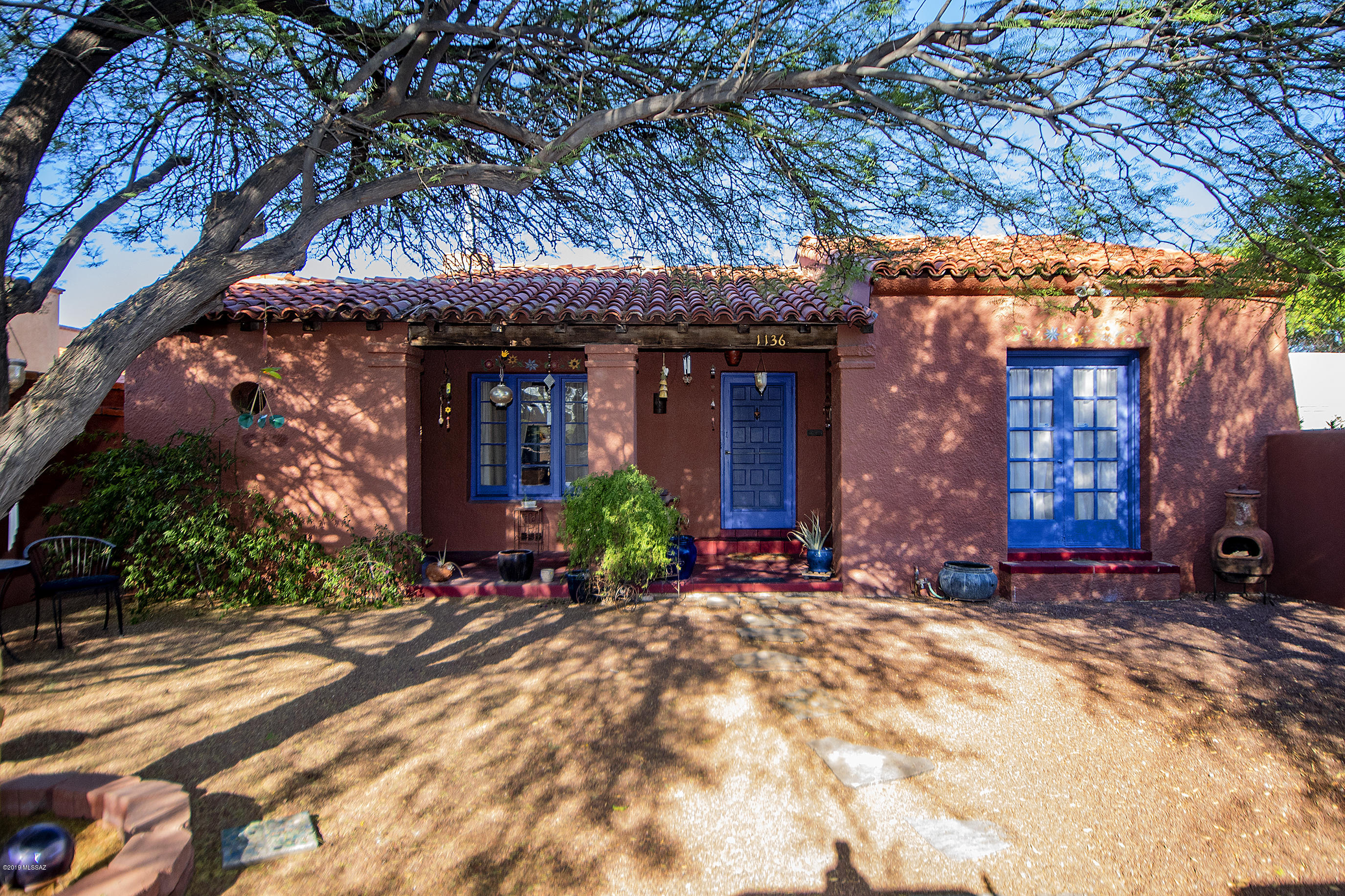 Fabulous 1929 Joesler!!! Historic and very CHARMING 3 bedroom/2 bath ''bungalow'' close to the U of A!  Enter large courtyard entry to a very special wood beamed front porch! Beautiful hardwood floors, gorgeous beamed and coved ceilings, large cozy fireplace, rich wood built-ins. So many special arches, niches and original touches throughout! Remodeled white kitchen with wood/butcher block countertop. Unique, vintage gas stove, stainless refrigerator. Many original light fixtures, french doors, loads of CHARM! Huge, low maintenance back yard with storage ''shed'' and hot tub! Absolutely incredible location close to EVERYTHING!
