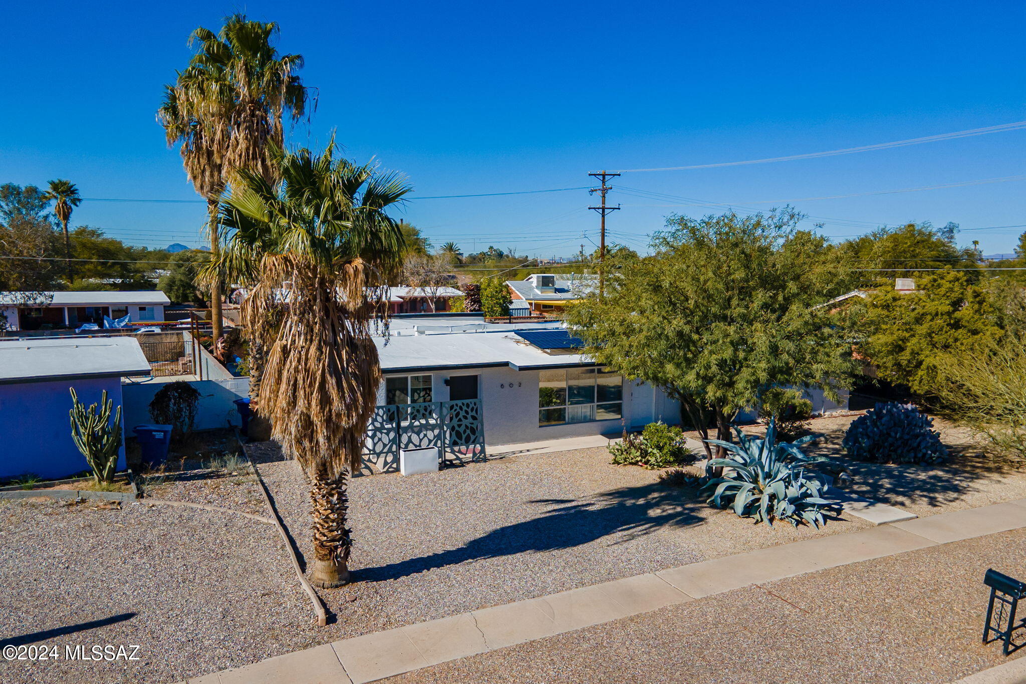 Great income property, three bedroom two bathroom home,  guest quarters with a kitchenette and private entry. Great room leading out to a private walled backyard featuring a heated 30 ft sparkling pool to use year round! The low-care nicely landscaped lawn is a great place to relax.  This investment opportunity is rented out as an AirBnB with many of the same tenants for the last few years. You can own this asset and start making your money work for you! New HVAC, tank-less water heater with instant hot water. Windows replaced in 2019 to amplify the energy efficiency and solar that is transferable to its new owner. Located in the heart of a highly sought-after neighborhood with parks, shopping, dining and so much.