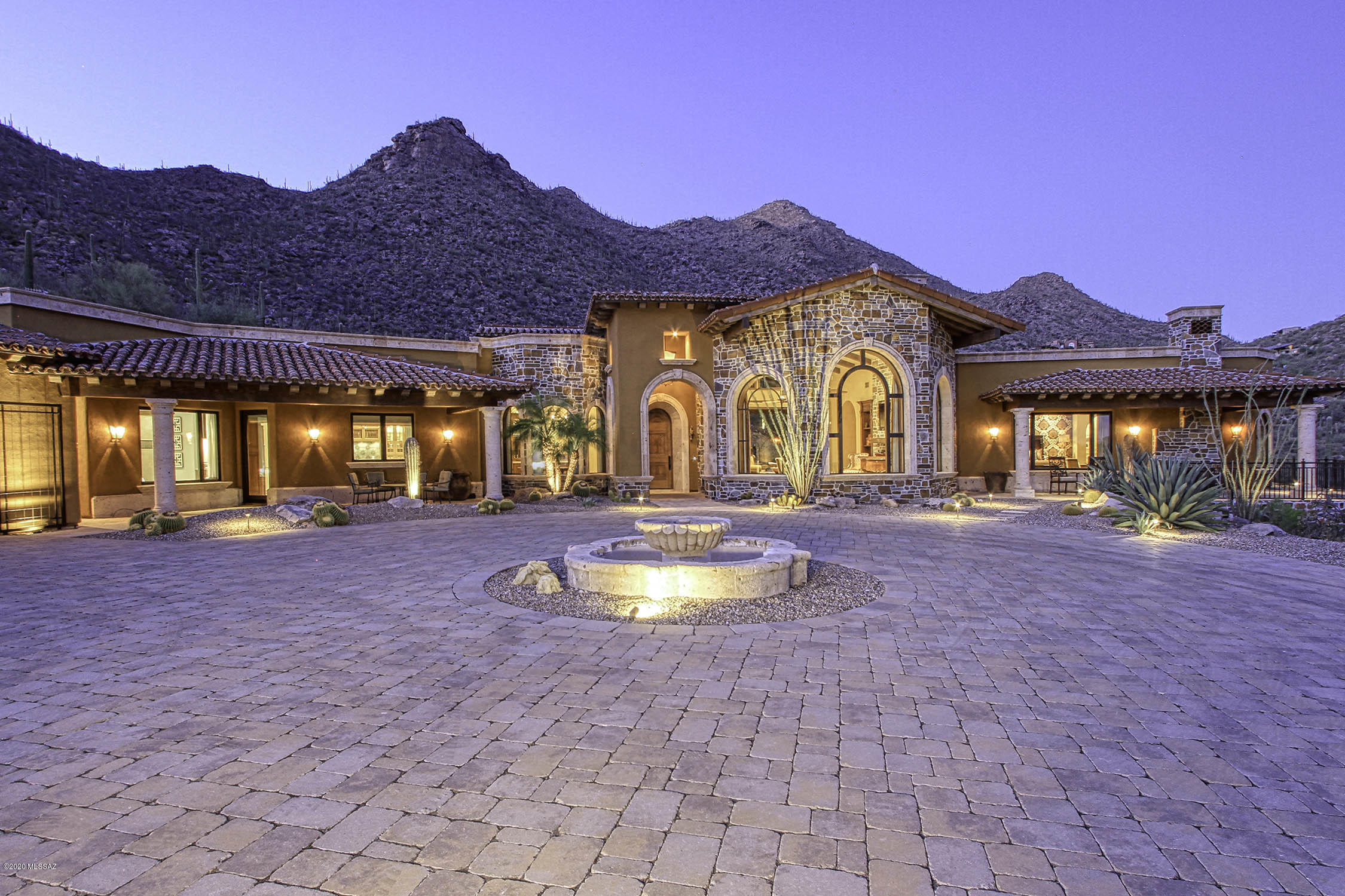 Enjoy Spectacular mountain and city lights views from this Gorgeous One-Of-A-Kind home! Meticulously built, no detail overlooked from exquisite design to finest of finishings. Including custom and hand painted tiles, Viking appliances throughout, custom laid marble and limestone flooring, custom walnut cabinets, doors and trim. Wood beamed, dome and barrel ceilings. Cantera stone. Breathtaking views from grand Great Room. Master suite oasis w fireplace, sitting room, private patio, walk-in shower, soaking tub, dual closets, steam room. Huge Home Gym, Fully equipped theater, Wine Room, attached Casita. Stunning secluded backyard with stone patios, custom pool/spa, firepit, water feature, outdoor kitchen and shower. Truly impressive home, more details in Highlighted Features document.