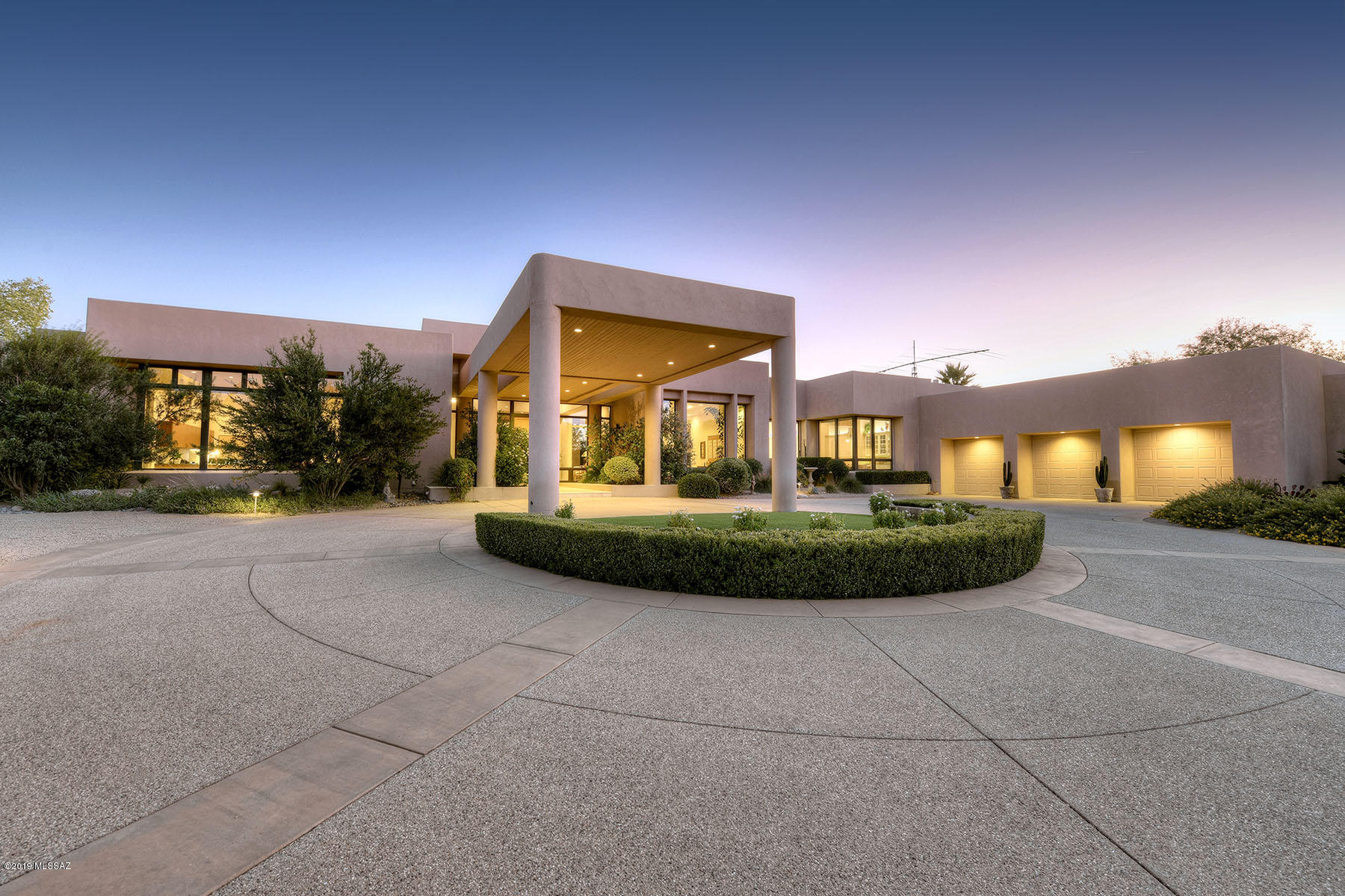Stunning, private near-northeast side estate on 6.37 gloriously landscaped and vegetated acres backing up to Sabino Creek with gated access to the river walk.  Electronically gated front entry and long and winding driveway leads past groves of trees, rose gardens, terraces and meticulously maintained yards to the circular front entry and porte cochere.  The glassed foyer of this 7,687 sq. ft., Ron Robinette designed with 4 en suite bedrooms plus den/activity room contemporary leads to the grand formal dining room with Catalina Mtn. views, then to the living room and adjacent kitchen which are ideal for large scale entertaining or intimate family gatherings.  LR features coved ceiling, fireplace, wet bar and walls of windows. Note the split floor plan with walls of windows and views from every room, 18" limestone floors.  The chef's kitchen offers generous cabinetry and granite counter space, designer appliances, gas cooktop and oversized center island.  The gracious master suite has dual vanities, dual walk-in closets and spa tub.  Don't miss the three car garage with oversized storage and workshop, glorious year yard with expansive covered rear patio and outdoor living spaces, outdoor kitchen, 16' X 40' pool, outdoor fireplace with bancos, lighted tennis court, city water and private well water, fruit trees, green house, koi pond and lush groves of mesquites.  Plenty of room for horse facilities from which you can ride out from Sabino Creek.  You won't want to miss this wonderful property that also includes tax parcel #114-49-010B.