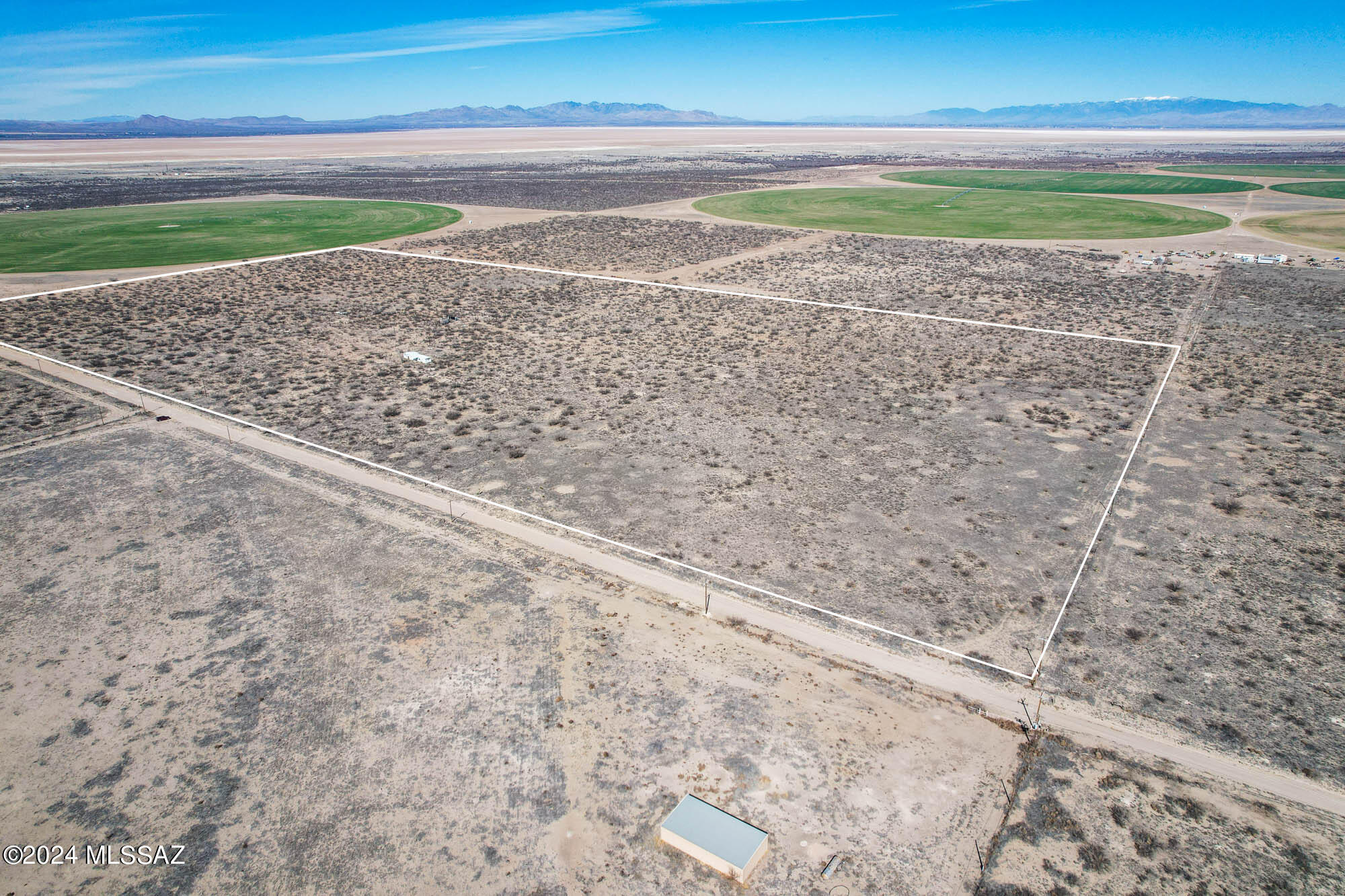 BIG PRICE REDUCTION!!! Fantastic opportunity for 80 acres of fenced vacant land with old residential structures, pens, and corrals. Power is already available on the property. This listing includes two parcels featuring an old domestic well, an old irrigation well (ADWR Records), and a homesite. The buyer should verify the utility of both wells. The residential improvements require attention, and their condition must be confirmed by the buyer. An expansive parcel, perfect for raising animals and creating your dream home. Approximately 2 miles from paved Kansas Settlement Road for a convenient commute. Embrace beautiful views, an unpolluted night sky with millions of stars, abundant wildlife, ample space, and total privacy for your own homestead!