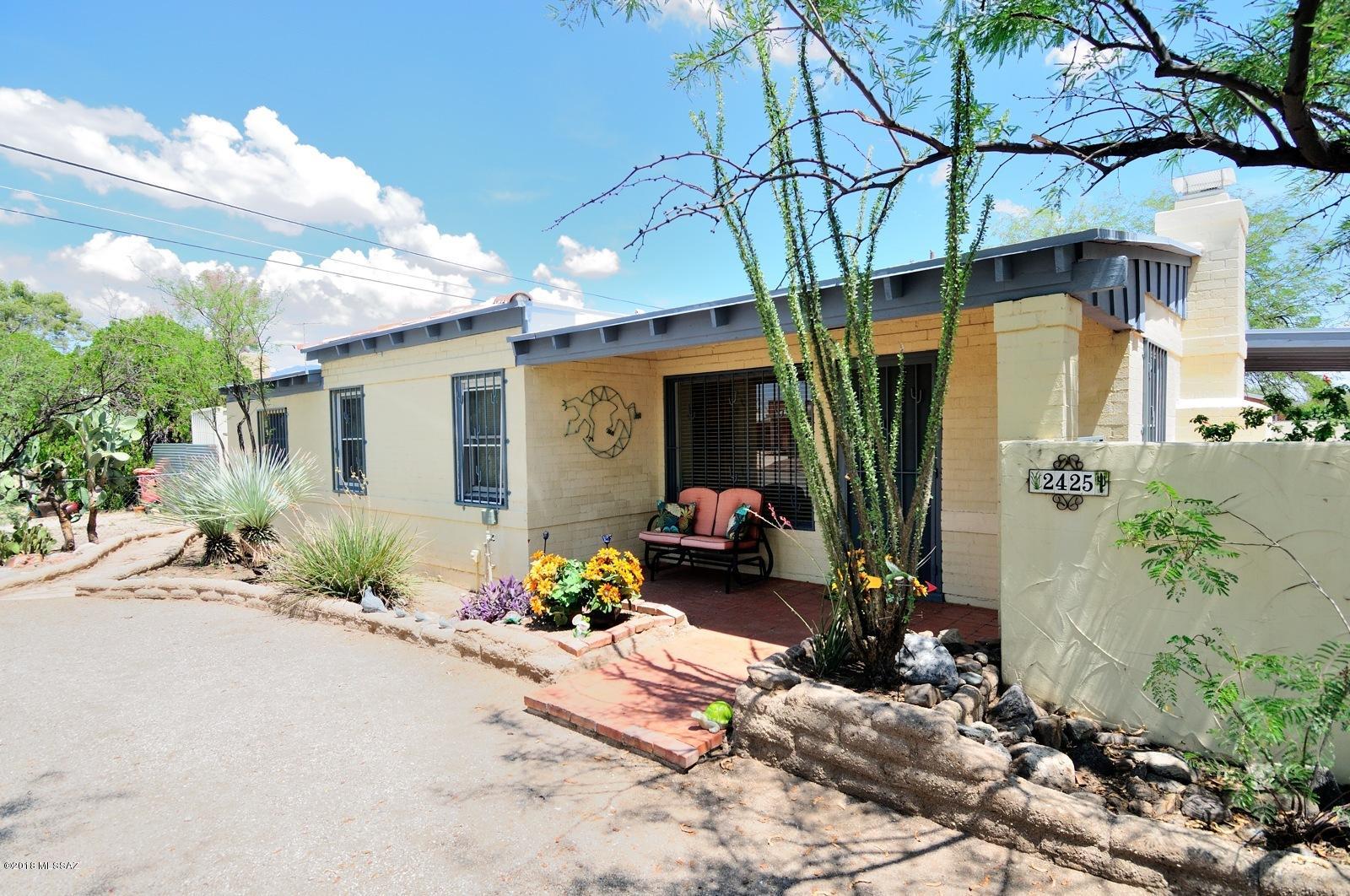 Mid-Century Modern in Historic Catalina Vista with New HVAC, Furnace and Water Heater installed Sept 2018.  Kitchen has newer cabinets and granite counters.  Lovely talavera in guest bath.  Higher ceilings, light and bright.  Cozy wood-burning fireplace.  Roof recently recoated, floors refinished, and freshly painted interior.  Each bedroom has its own entrance.  Large laundry room with tons of storage space.  Circular driveway and huge back yard with double gates on a corner lot.  Owner occupants can apply for the historic tax credit.  Tahoe Park, Bicyclists paradise close to The Loop.  Walk or bike to Banner Hospital, UofA, Modern Street Car, Culinary Dropout, Arizona Inn and so many restaurants, pubs and shops at Campbell Ave Shopping, 4th Ave and Downtown.