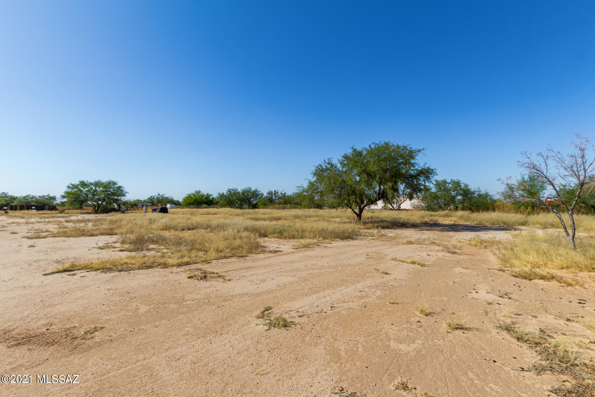 Flat and level homesite that has available  electricity, water, and septic that is perfect to build your dream home on the range. The lot is huge and has plenty of room for toys and animals. This is rural living at its best! Come see it today and make it yours! Owner is a licensed agent.