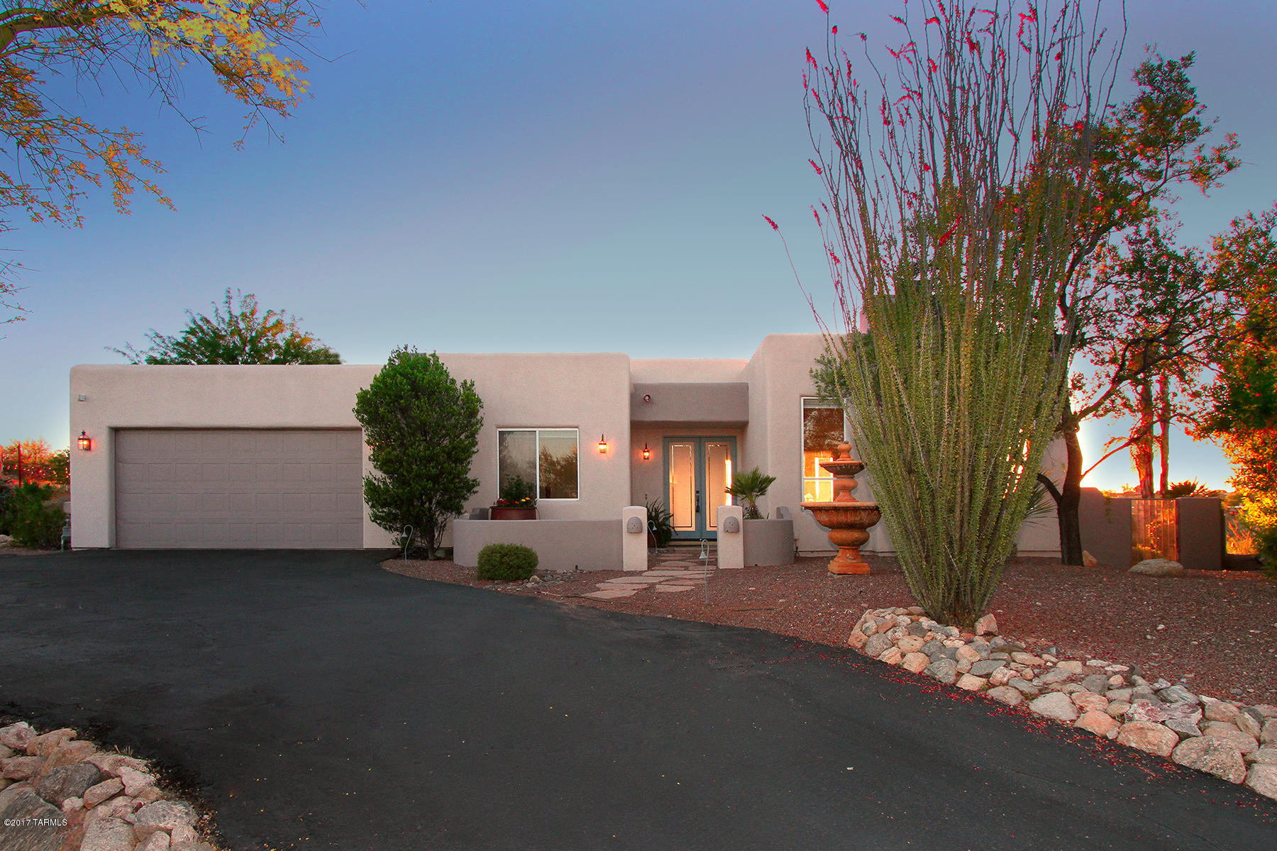 Not too big, not too small, this lovely contemporary home is just right at 3002  sq. ft. You will love the resort style backyard w/salt water pool & spa to enjoy the spectacular Catalina mountain views & gorgeous city light w/complete privacy! Inside is a grand living room w/fireplace, classic dining rm, cozy family room, open kitchen w/granite counters, stainless steel appliances. Split bedroom plan. The master is truly a suite, with lg sitting room. Only one room doesn't have incredible mountain views. Dual zoned heating and cooling. water purification/softener. California closet in master. Surround sound inside and out. Come and buy.