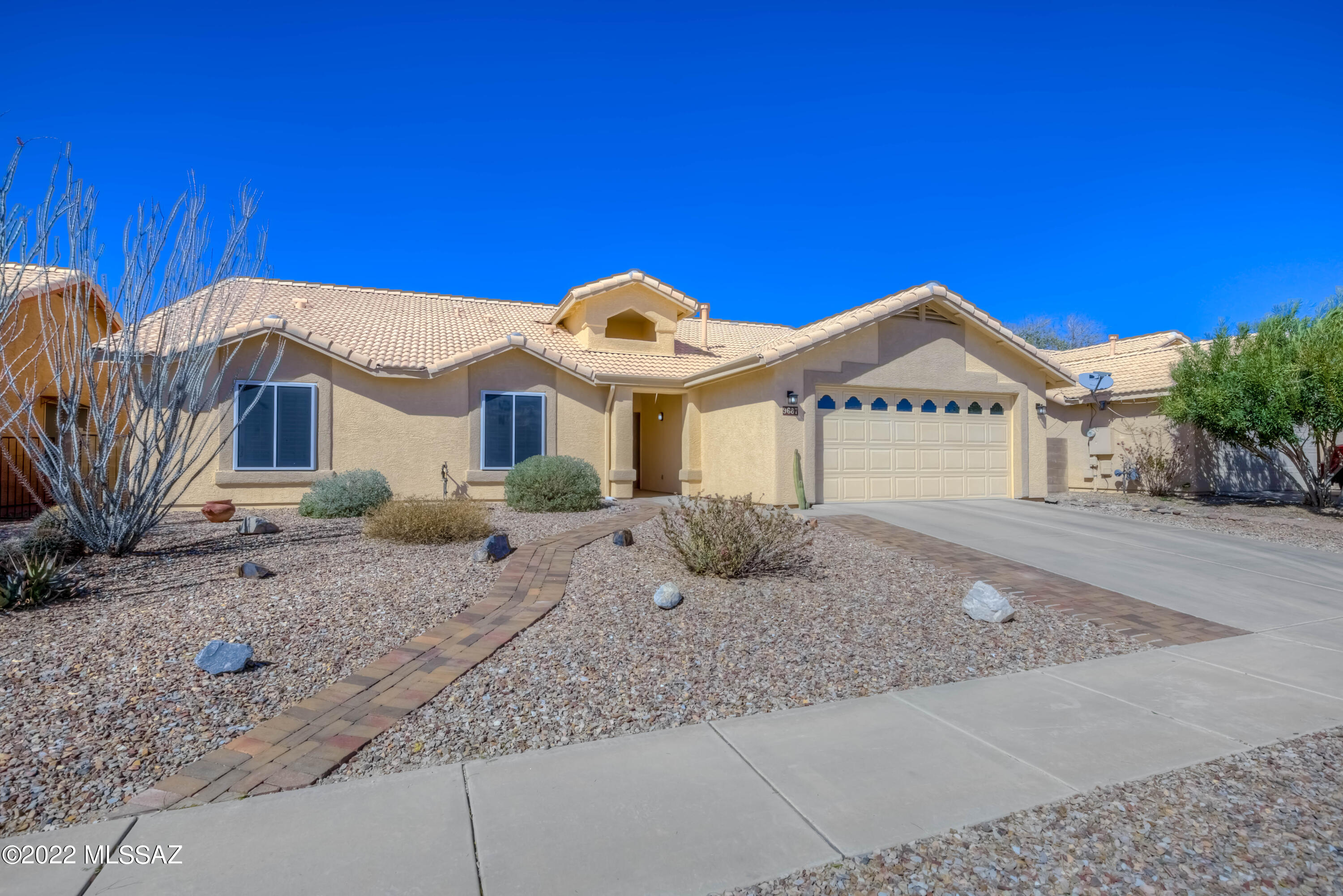 Immaculately maintained home in Vail School District! This wonderful 2156 SF boasts tons of space with its large living spaces and 4 bedrooms. The curb appeal will wow you and the inside will not disappoint. Hard floors throughout, soaring ceilings, separate living and family room with the family room being open concept with the kitchen make the floorplan the best of both worlds. 4 bedrooms including a spacious owner's suite w/custom tiled shower and walk in closet.  HVAC replaced in 8/2018, water heater 8/2018, exterior painted in 4/2019, security screen in Owner's suite installed in 2015. This home has been meticulously maintained & it is easy to notice. Out back you will find an extended patio, pavers, turf, & fruit trees.