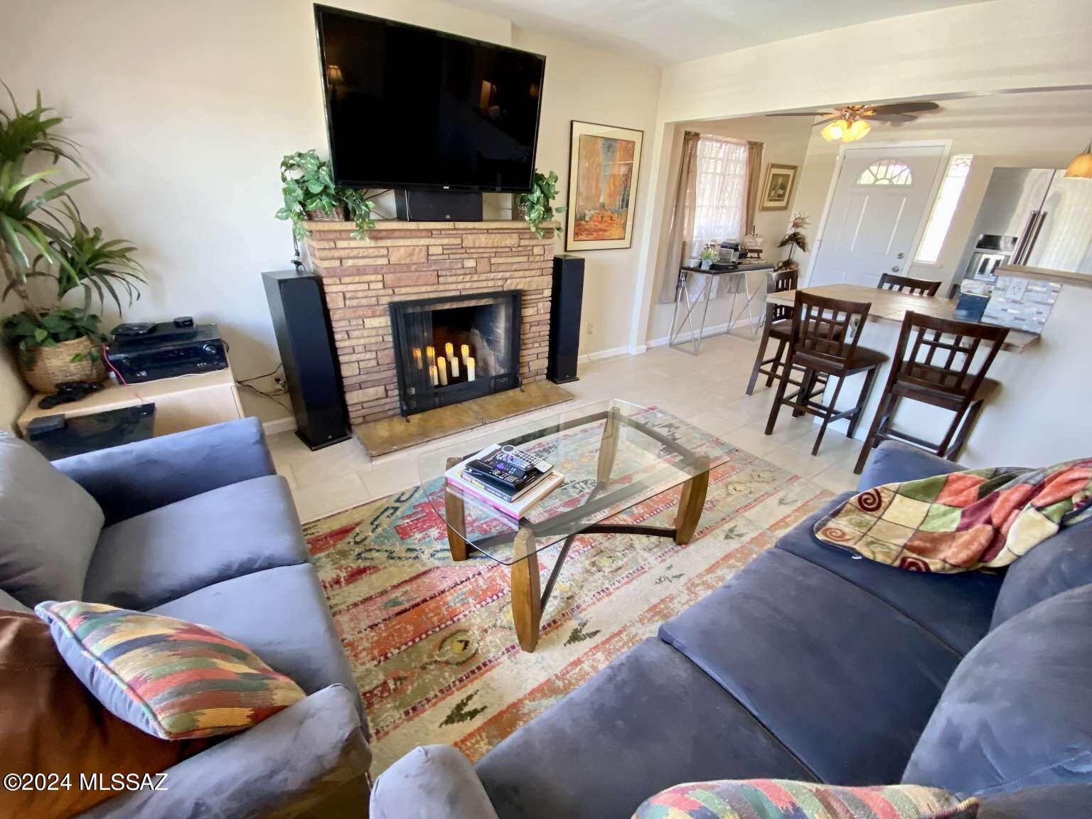 Beautifully renovated home located walking distance from the University of Arizona's main campus in the historic Jefferson Park neighborhood with loads of potential! This lovely red brick home features a great floor plan with three bedrooms, new title and laminate flooring, fresh paint, covered rear patio, fully fenced and landscaped front & back yard on a premium elevated lot boasting great views of the Catalina Mountains. One of the best features of this centrally located charmer is the near quarter acre lot with detached 25ft x 25ft two car garage situated on the SE corner of the property. Currently utilized as a shop/ storage, the rear building is accessed from the rear alley and has it's own fence making it an ideal opportunity for those needing lots of space or whatever you envision