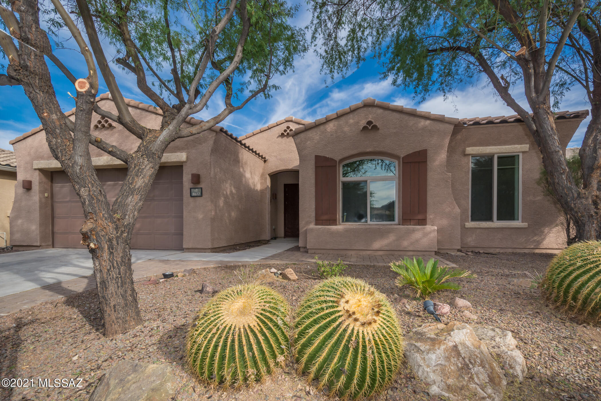 WOW! Stunning 4BD/2.5BA w/freshly painted 2 tone entire interior top to bottom, brand new carpet in formal living & dining rm & bedrooms. Master w/expansive wall to wall bay window. Bath w/his & her vanities, separate shower, garden tub & huge walk in master closet. Large neutral tile in family rm off kitchen & hallways. Gas fireplace. Gourmet kitchen w/tier step rich cherry cabinets, top of the line SS appliances including GE Profile 4 burner gas range w/added gas griddle burner, granite counters, & breakfast nook w/bay window. Surround Sound, Big sky & mtn peak views thru lrg planked plantation shutters covering all windows.  Fully extended back covered patio for optimum entertaining. Oversized backyard borders wide open common area for added privacy.  3 car tandem garage w/utility sink.