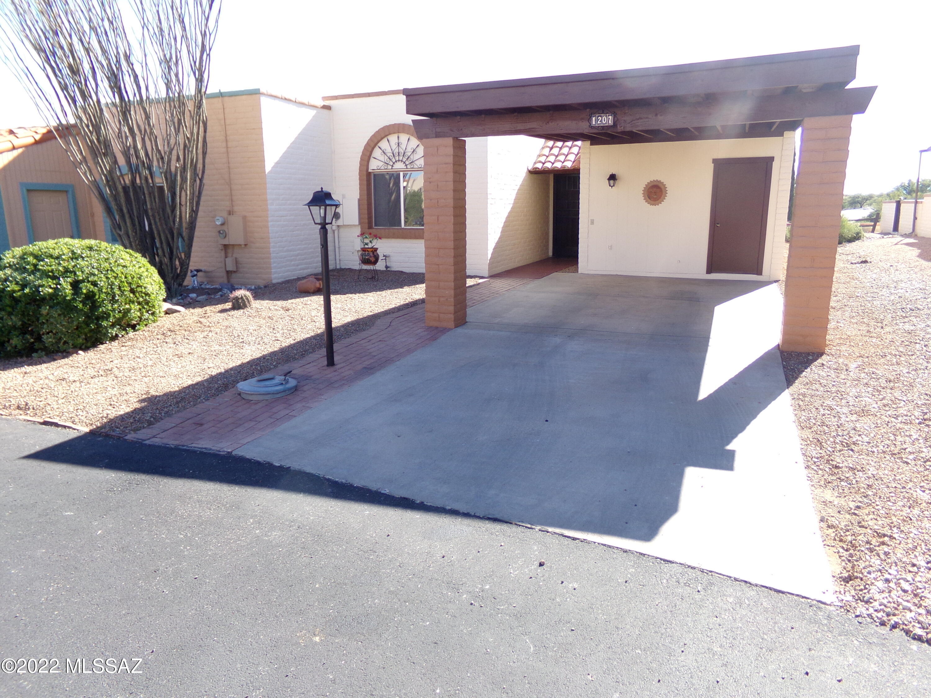 Looking for one of the best views of the Santa Rita's in Desert Hills II, look no more. The unobstructed views from the patio and back yard are spectacular.  This townhome of 1,165 sq. ft. offers 2 bedrooms, 2 baths and spacious eat in kitchen with ample storage space in laundry and double closets in both bedrooms. Abutting the common area allows for window exposures in the kitchen and living room.  Recent repairs include repair or replace exterior wood surfaces, new laundry box and valves, new roof above the initial roof deck, new exterior base paint and trim and new HVAC unit.  This townhouse is a must see for both full and part time residents.