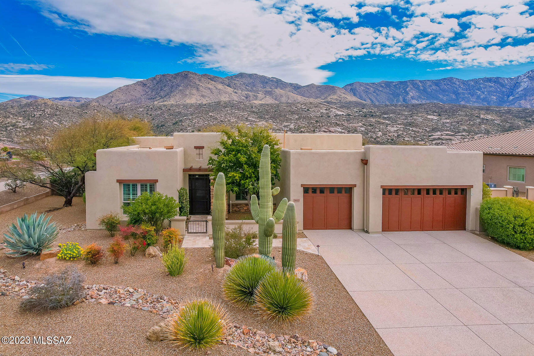 Exquisite golf course lot home in Saddlebrooke Preserve affords breathtaking mountain views. Luxurious amenities include Travertine tile, plantation shutters, remote indoor/outdoor sunscreens & ceiling speakers. Enter through a gated courtyard to find soaring ceilings, floor-to-ceiling view windows & neutral décor. This Canyon model offers 3 en-suite bedrooms, powder room, multi-use den. Large gathering room showcases central island, granite counters w/tile backsplash & luxury appliances. Owner's suite hosts luxury bath & walk-in closet. 3-car garage w/Tesla charger. Retreat to the rear Travertine patio fully enclosed by remote sunscreens. Rear yard boasts a decorative turf lawn, hot tub & wrought iron fence accentuating the views. Perfect for the most discerning buyer! See 3D tour.