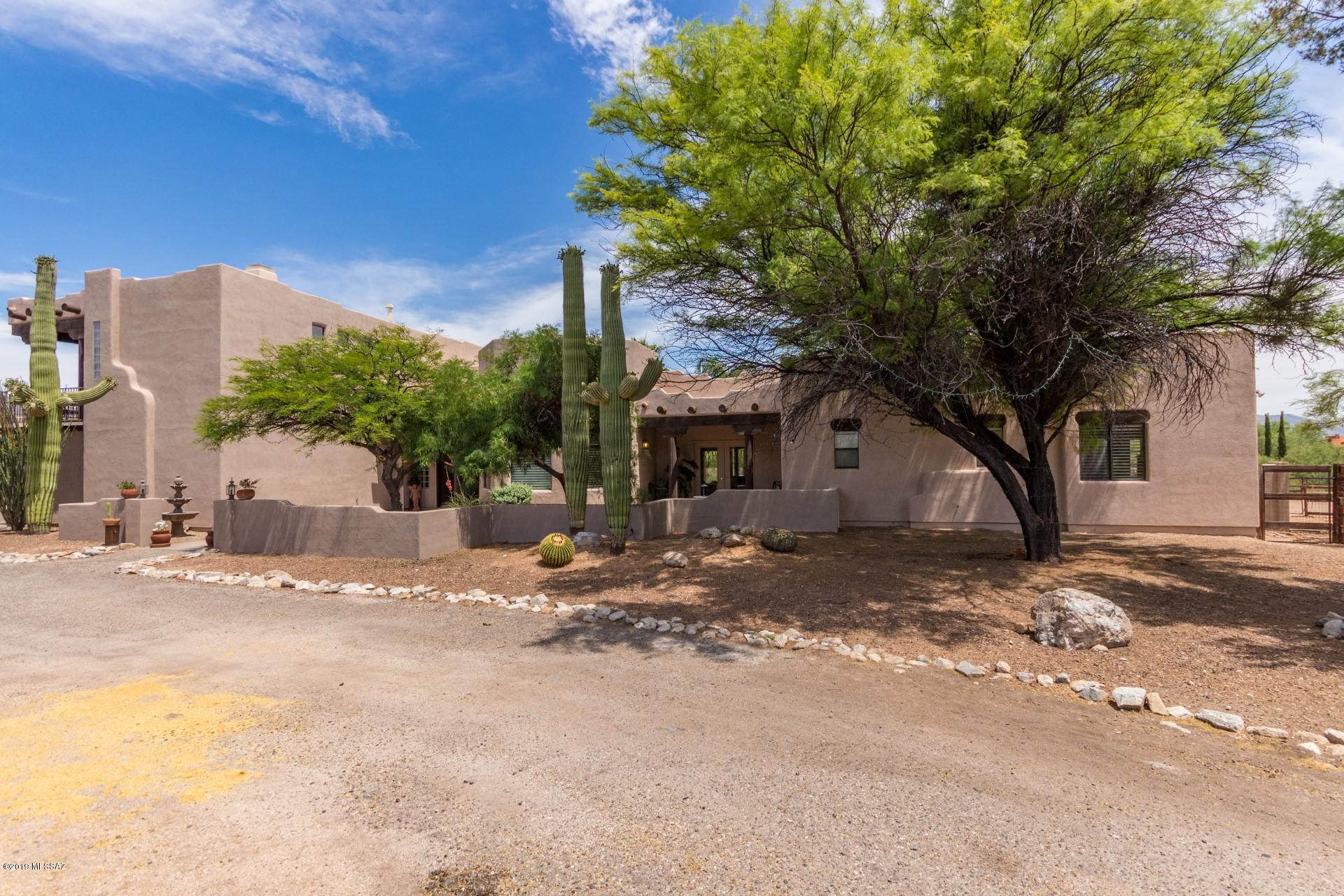 Gentleman's  ranch  perfectly located on the East side of Houghton and Tanque Verde roads.  Just slightly over 1 acre horse property with horse barn and corral nestled into one corner of the property. Freshly painted on the outside and full of natural light on the inside. the home features a formal dining room, with room to eat in the kitchen also. The home features 2 good size living rooms, one off the kitchen and the other near the main entrance. Three good size bedrooms downstairs and a good size laundry room. The master suite is located on the 2nd floor with a balcony that overlooks the Catalina Mountains. There is a perfectly situated in ground pool with spa fenced off from the house and barn.  Two new HVAC units and one new water heater in 2018.
Book your showing today !