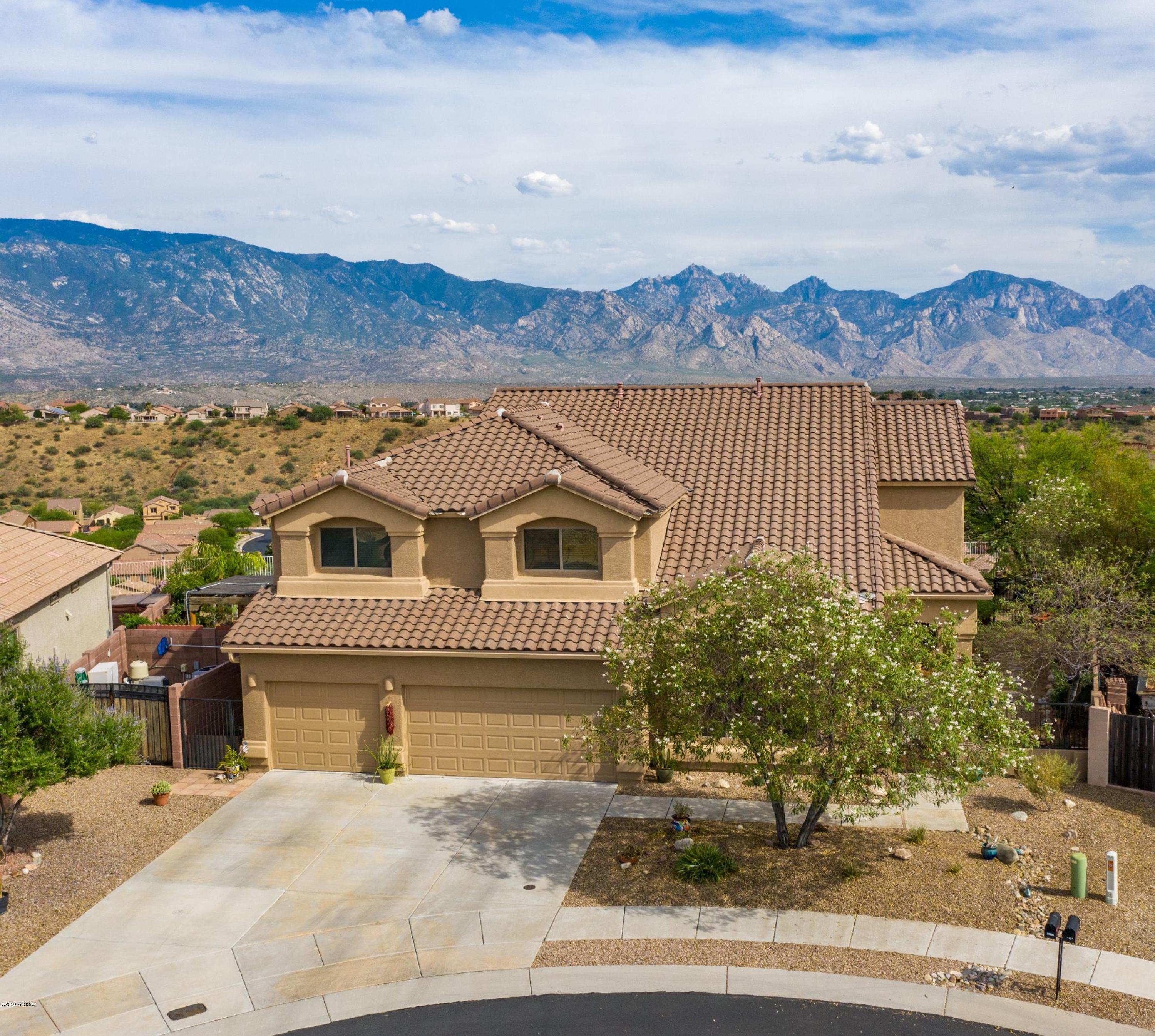 TRULY STUNNING!! An elegant home sitting perched high atop ''the Ridge'' in Eagle Crest Ranch offers 3,612sqft in a thoughtful, split 5 bedroom floorplan. A sweeping staircase greets you upon entering & formal dining & living rooms create an expansive entertaining space. A very well-appointed kitchen is open to the family room w/endless mountain views. A full downstairs bath is just adjacent to a guest bedroom or home office. Upstairs a large loft opens to a private balcony overlooking the pool & inspiring views. An ample master includes a separate shower, tub & large walk-in closet. A guest hall leads to the remaining upstairs guest bedrooms & full bath. Out back a large lot allows for a refreshing pool & spa, a private gas firepit & full covered pergola w/built in grill. Completely lovel
