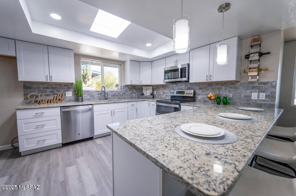Fully Remodeled 4-bd 2-ba home w/2 car carport in the Rolling Hills!NEW dual pane windows.Fantastic curb appeal w/large driveway &well-manicured landscaping.Inside you will find an inviting large family &living rm w/upgraded ceiling fans,recessed lighting,a fresh neutral palette,beautiful LVP flooring throughout the main living spaces,wood burning fireplace &more!The stylish kitchen boasts brand-new appliances,cabinetry &granite countertops.The sizable primary bedrm includes soft carpeting w/an ensuite bathrm including a dual vanity w/a floor-to-ceiling tiled shower.The remaining bedrms are ample size w/soft carpeting and share the hallway bathrm including a shower/tub combo& dual vanities.All new windows &doors.Be surprised by the wonderful backyrd w/cvrd patio.Price range-$429987-439987