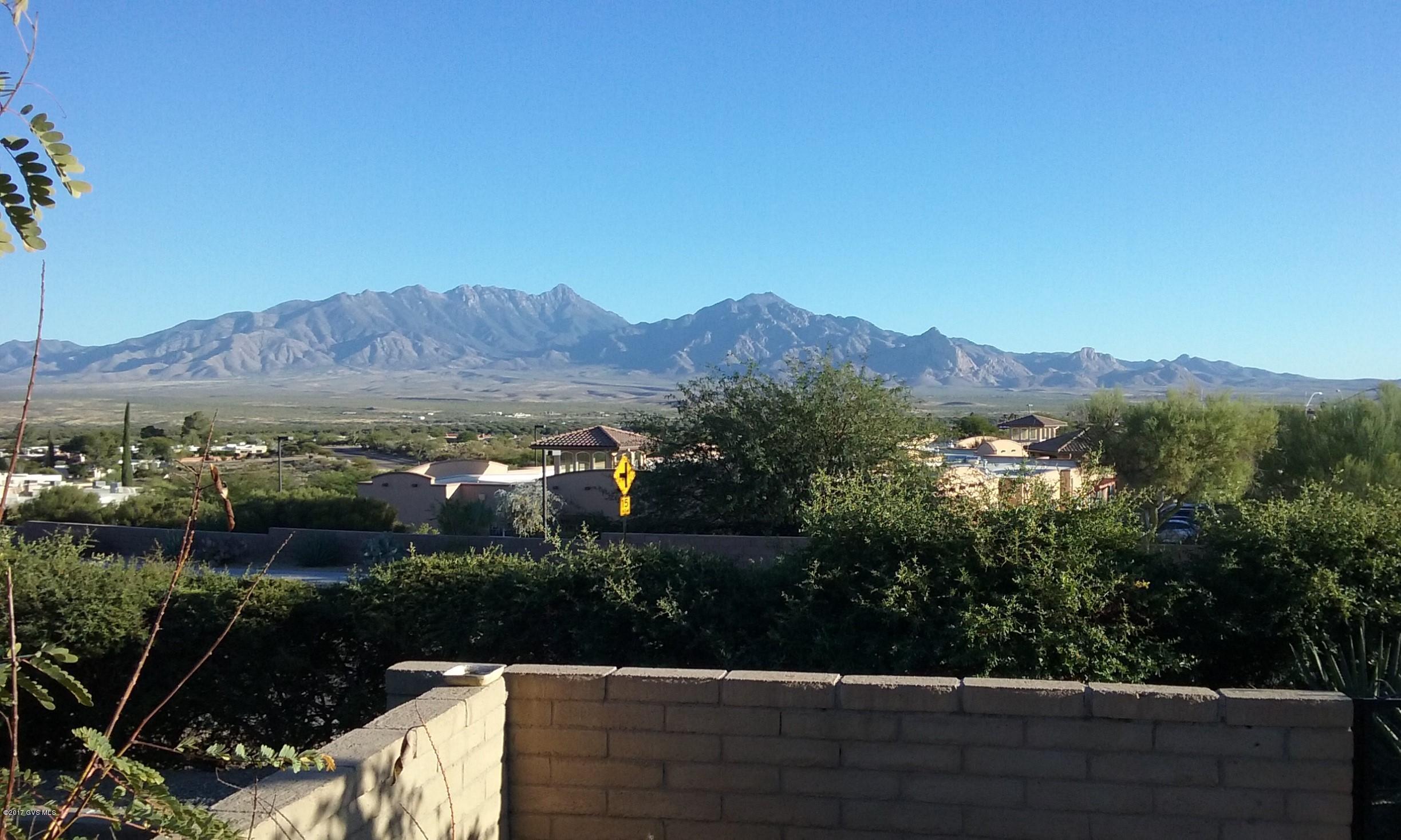MILLION DOLLAR VIEW! Don't miss this 2bd/2ba Townhouse in Desert Hills 2 that has been redone from floor to ceiling & door to door in all the latest decorator colors. ALL NEW: interior paint, custom tile floors in living areas, carpet in bedrooms, front door, MB door, stainless appliances, double sink, granite tile countertops, refinished cabinets, nickel hardware, mini subway tile backsplash, lighting fixtures, ceiling fans, ventless compact stacking LG washer/dryer, RHEEM water heater, sinks, vanities, mirrors, toilets, plumbing fixtures, baseboards, crown molding & tile shower in guest bath. Popcorn ceilings no more! All have been removed & re-textured. Did I mention the panoramic mountain VIEW?! An added bonus is the new, unique built-in coffee bar with mosaic tile  backsplash... cabinets above & below & soft under cabinet lighting as well as a coat closet. You'll be glad there's a Murphy bed in the guest room because all your friends will want to visit. Even the outside storage closet has had a makeover with cabinets & shelves. The patio has pavers & is enclosed by raised beds (or seating) & is home to an orange tree. With nothing behind it the VIEW is endless! Leased solar panels are easily transferable & keep your electric bill low in summer & winter. In a cul de sac with guest parking just steps away. Desert Hills Golf Course & Desert Hills Social Center are both within walking distance.