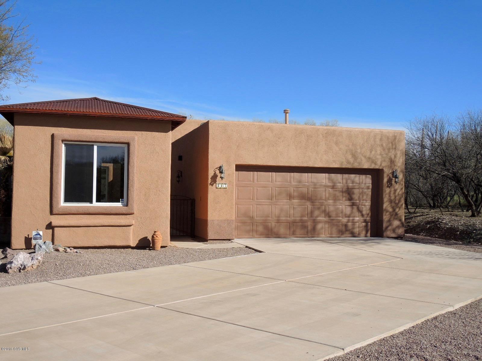 Popular ''Dorn Homes'' Fairmont model with casita on premium lot has tons of living space and privacy. Inside there are 3 bedrooms and 2 baths. One bedroom can be easily used as a den or office. The casita offers an additional bedroom and full bath. Great finishes throughout including hard wood flooring in main living area, surround sound and mesquite mantle. The eat in kitchen has granite counters. This home is priced to sell. Easy access to Anza trailhead and close to all Tubac amenities