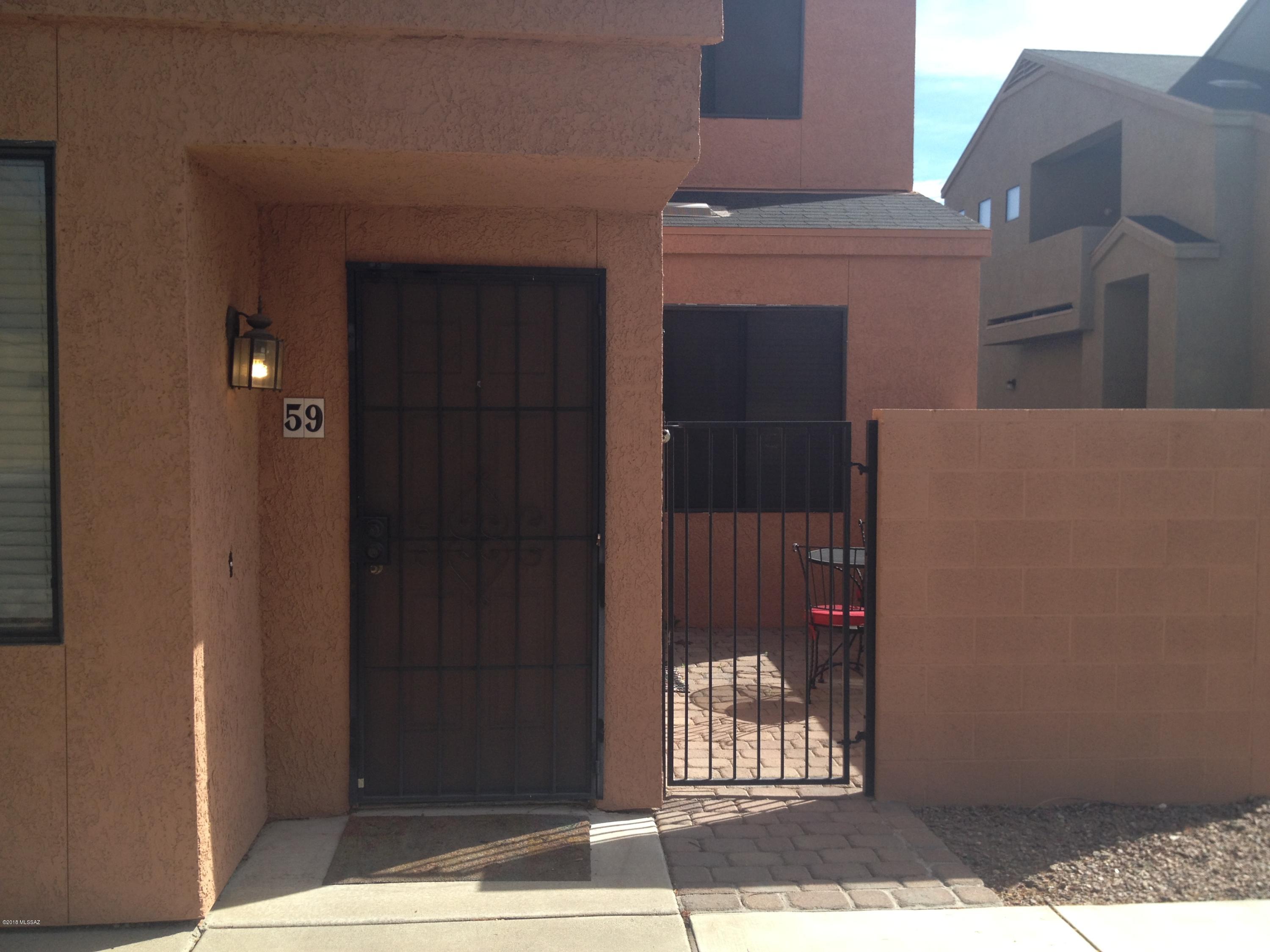Amazing opportunity to own a Condo located between the University of Arizona and one of Tucson premium shopping & dining destinations. 1465 sq ft, 3BR 2BA condo loaded with all the upgrades you should expect. All three bedrooms are large and two feature walk-in closets. Feel secure driving into the 2 car garage with remote entry. The split floor plan features a bedroom and bath downstairs & 2 bedrooms and bathroom. laundry(including washer & Dryer) upstairs. The kitchen features black appliances, refrigerator, stove/oven & microwave surrounded by black granite counters. All window covering included. The HOA Includes access to the community pool/spa, water and trash as per attached HOA Document. Close proximity to U of A (on mountain ave bike path).