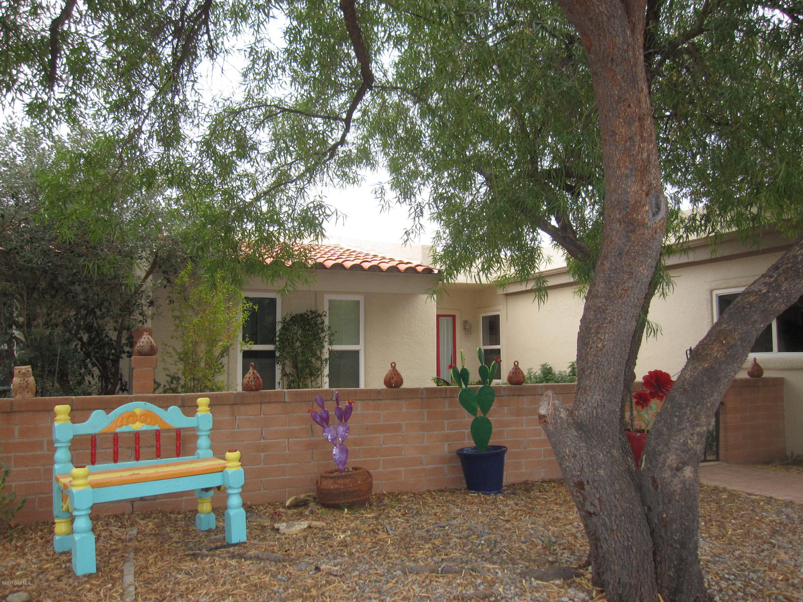 SMELL THE ROSES! 20 PLUS VARIETIES OF ROSE BUSHES. YOU'LL SPEND LOTS OF TIME IN THE BACK YARD! LOVELY COVERED PATIO - SPARKLING FOUNTAIN - DAZZLING MOUNTAIN VIEWS. LUSH DESERT AND COMMON AREA INCLUDING A WALKING PATH SURROUND THIS SPECIAL END UNIT TOWNHOME! COMPLETELY TILED THROUGHOUT, THIS SPACIOUS 2 BEDROOM HAS ADOBE WALLS LENDING SOUTHWESTERN WARMTH TO THE OPEN FLOORPLAN. KITCHEN WITH NEWER APPLIANCES. BEAUTIFULLY REMODELED BATHS WITH GORGEOUS TALAVERA TILE! SPACIOUS 2 CAR EXTENDED GARAGE GIVES YOU PLENTY OF STORAGE ROOM PLUS A WORKBENCH. DUAL PANE WINDOWS FOR HEATING AND COOLING EFFICIENCY. LOW VOLTAGE YARD LIGHTS AND DRIP IRRIGATION. AFRICAN SUMAC TREE IN THE FRONT YARD SHADES THE ENCLOSED PATIO. ENJOY THE SUNSETS! THVI HAS 20 ACRES OF BEAUTIFULLY VEGETATED DESERT. HURRY!