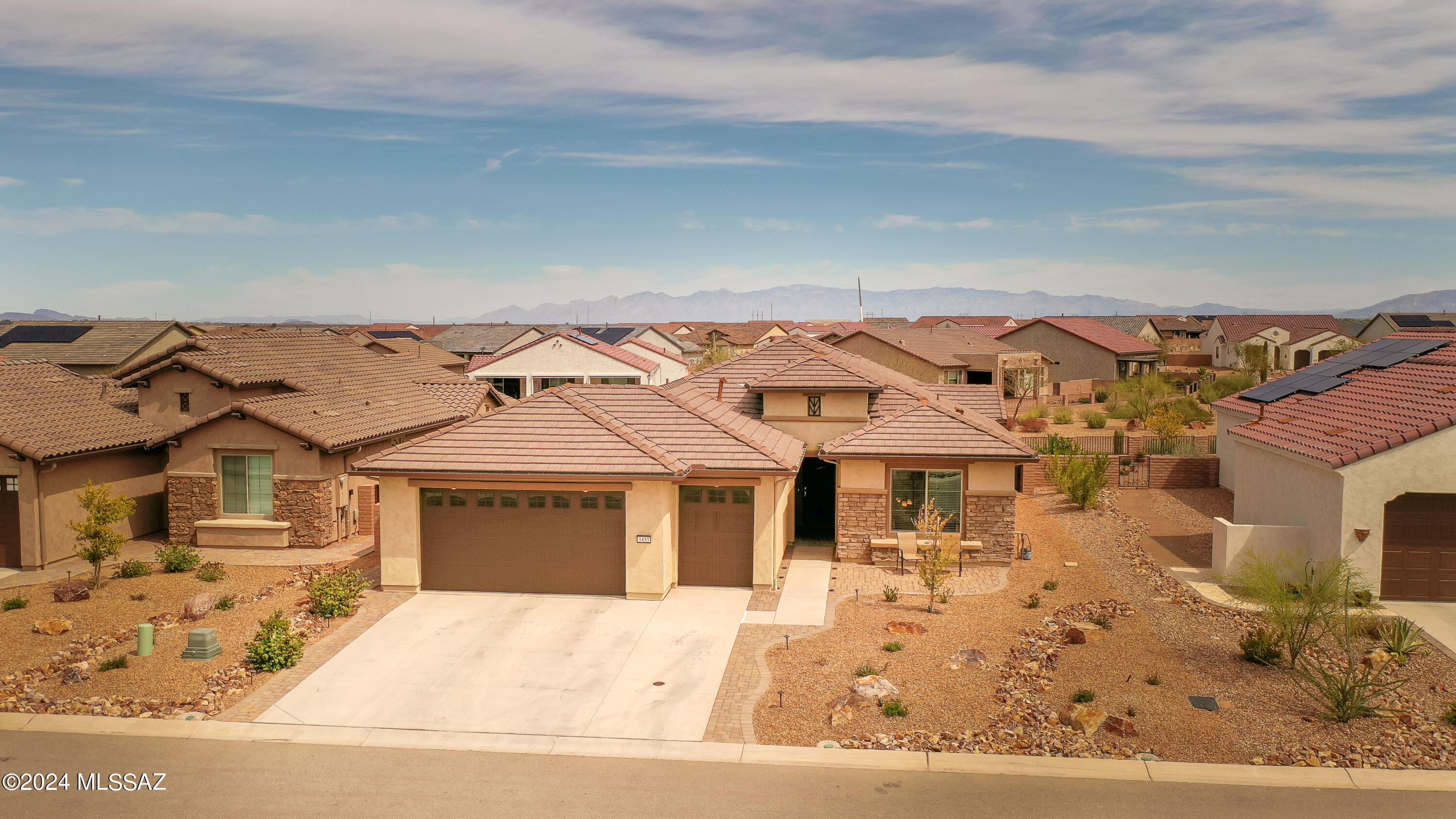 NEWLY BUILT HOME, FINISHED IN 2021! Look no further because this exceptional home is the one for you! This magnificent 1 story home built in 2021 is located in the beautiful and desirable community of Quail Creek, here in Green Valley, AZ. At 1,678 sq ft, you have 2 bedrooms with a den, 2 full baths, 2.5 car garage, and beautiful green common area behind your home! This sought after design known as the Montecito floor plan offers an open concept layout. Enjoy your kitchen with gorgeous cabinetry and quartz countertops that opens right up to the living room and dining area. Spacious primary suite and primary bath with decorative tile shower, double vanity with quartz countertops, and spacious walk-in closet. The guest bath comes with a tub & tiled shower, along with a quartz vanity. Your extended laundry room comes with cabinets & hanging storage. Enjoy having company while showcasing your beautiful backyard that's completely landscaped with pavers and artificial turf; along with automatic screens that offer shade and privacy! Your huge garage comes with a secondary door for your golf cart or extra storage space. And it finishes off with fully epoxy floors and a water filtration system. This house is ready to move in so don't wait any longer!