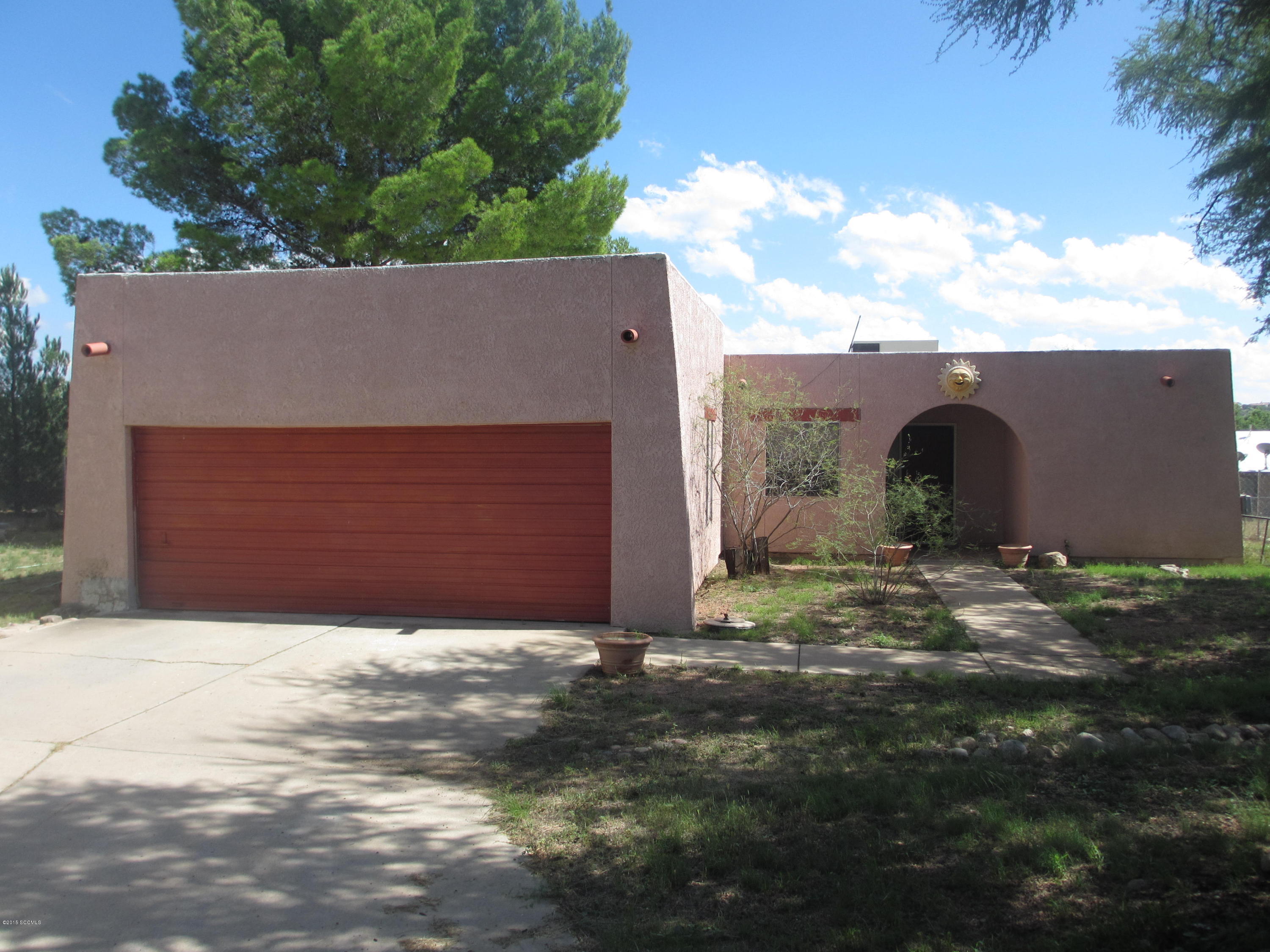 A very nice well maintained Santa Fe style home!! Home sits at the end of a culdesac, adjacent to Coatumundi Middle School .. Has A/C, tile flooring, covered patio, enclosed block wall w/ beautiful views of the mountains!!