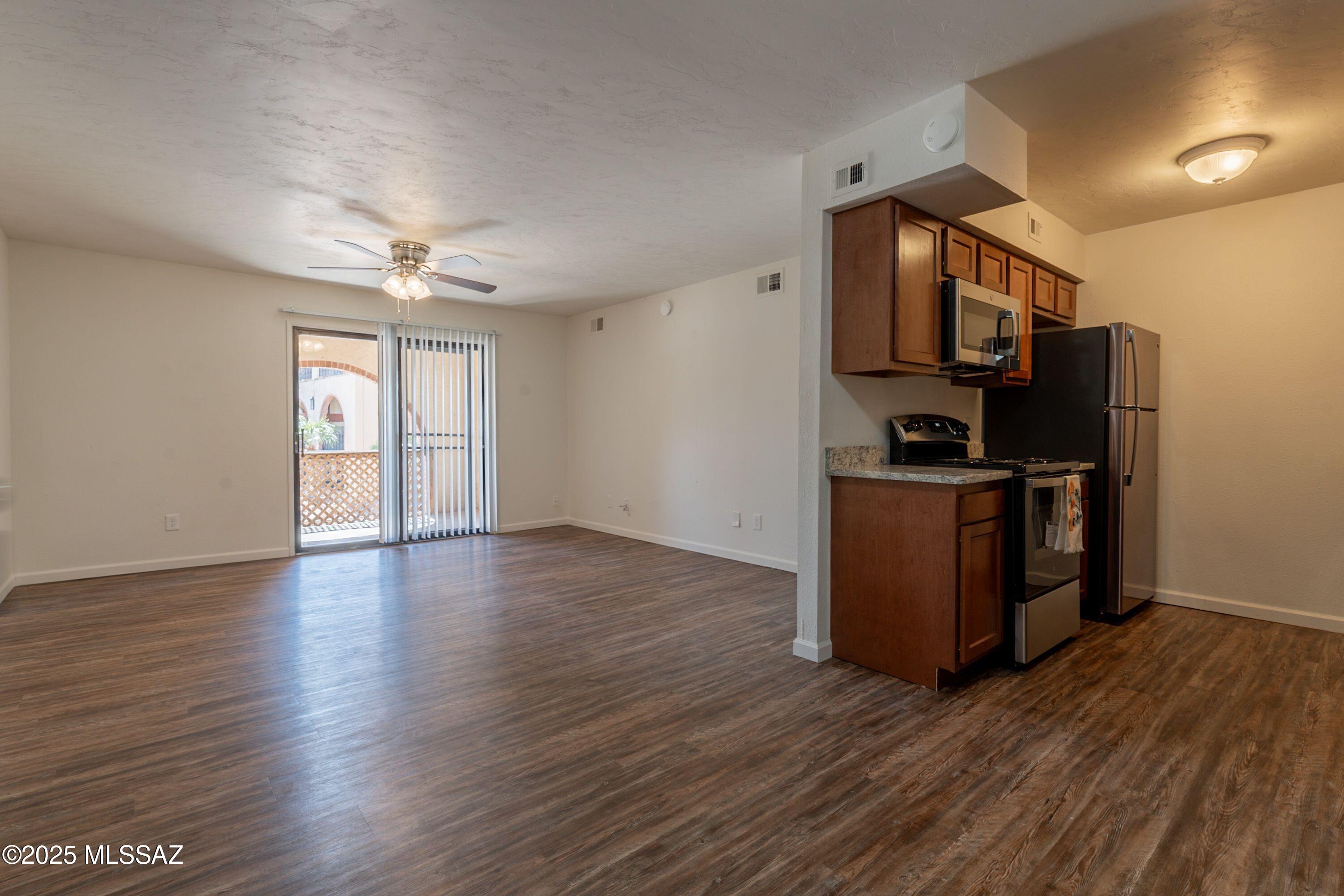 Recently renovated with new floors, new kitchen and appliances, charming 2 bedroom 1 bath home, Primary bedroom has vanity with sink only, balcony, on site laundry, mid level unit, includes 1 covered carport, A/C