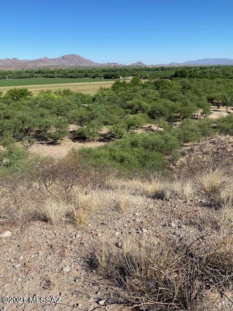 This is a beautiful approximate 11 acre parcel overlooking the entire Santa Cruz River Valley in Tubac!  Situated east of the River this parcel has mature mesquite trees in the lower area but also has  high mesa's overlooking the River corridor and the Santa Rita and Tumacacori Mountains in the distance. This property is outside of an HOA and is ideal for building.
