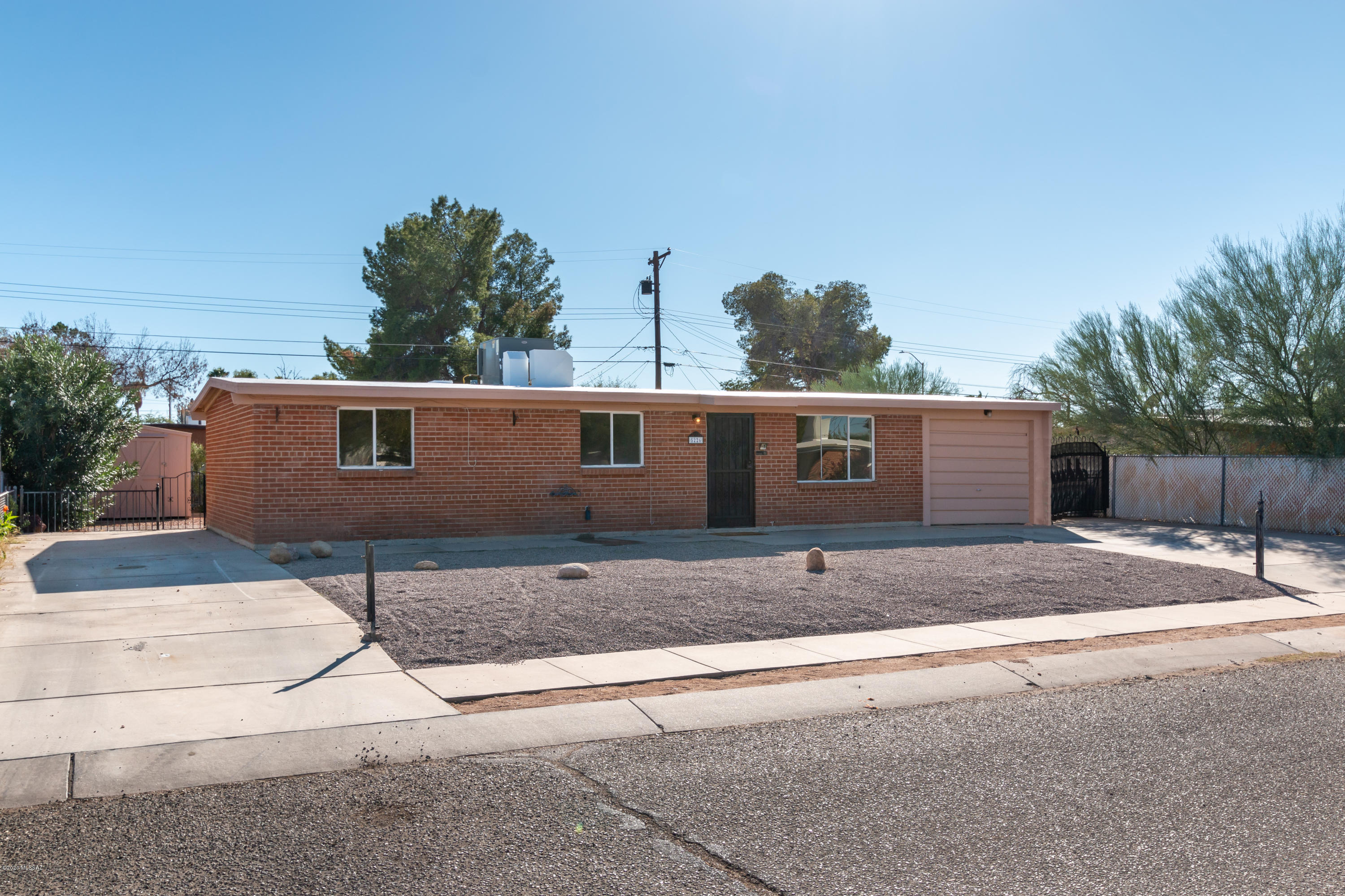 Just renovated, move-in ready.
Great central location near shopping, dining, and less than 6 miles to the U of A. 
New wood-like tile throughout, new carpet in every bedroom, grey color pallet, light and bright - open floor plan. The kitchen offers beautiful grey granite counters, white cabinetry, SS appliances with a gas stove, and a large island for ample counter space! Bonus room addition in the back; perfect for formal dining, game room, office, or extra living space. Enjoy the covered back patio overlooking the large fenced-in yard with a built storage shed/ workspace. HVAC only 5 years old, No HOA, 1 car enclosed garage, and large additional parking space on the left side of the home. Schedule your showing TODAY!