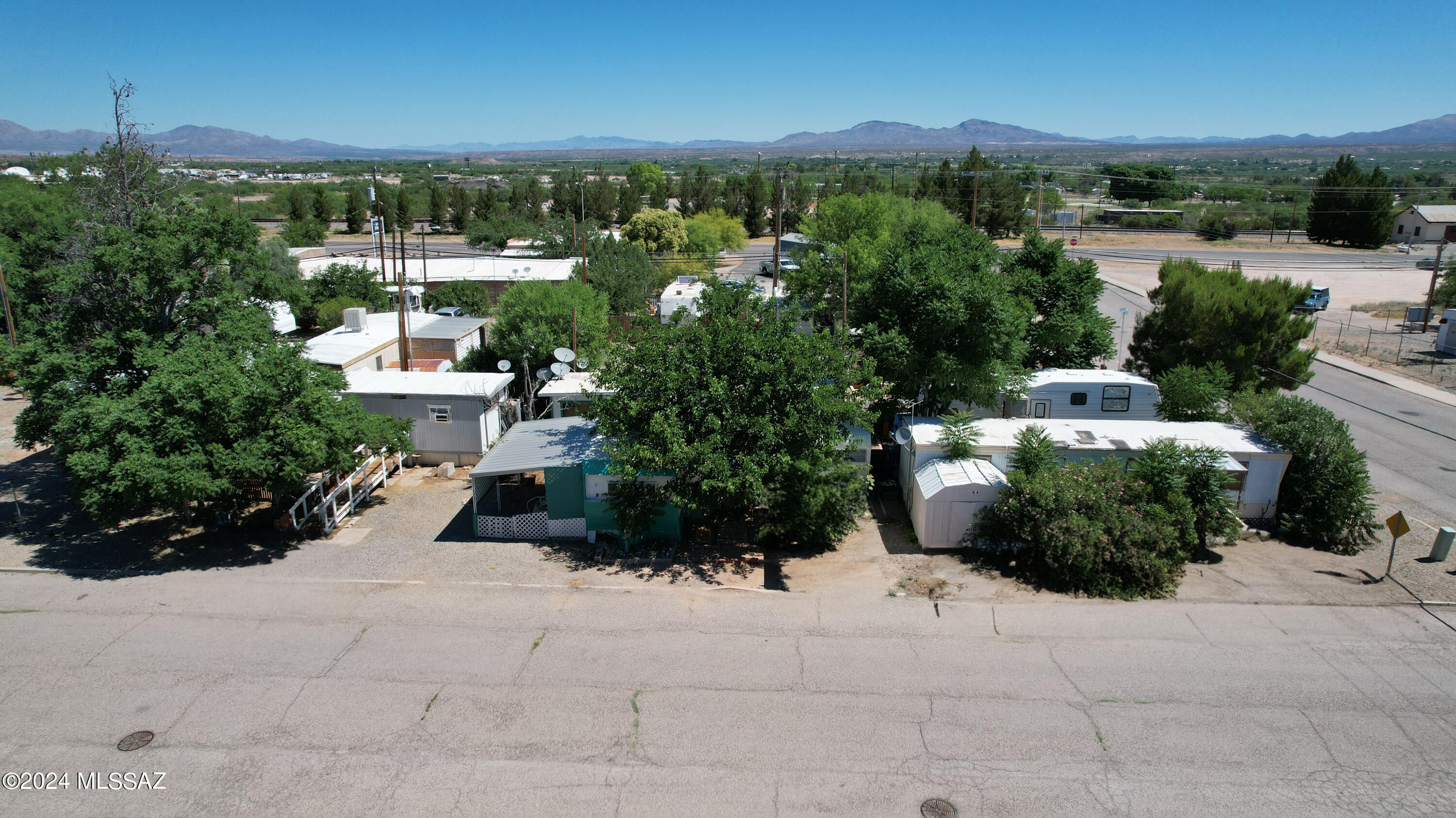 Charming RV/trailer park nestled in the heart of Benson, AZ, on  0.69 acres with 15 spaces - 13 of which are currently leased. Each space offers water, sewer, and electric amenities. In certain spaces, renters handle direct payments to the electric company. Convenient shopping options nearby, and the park doesn't own any of the mobile homes. Also includes parcel # 123-20-058B.