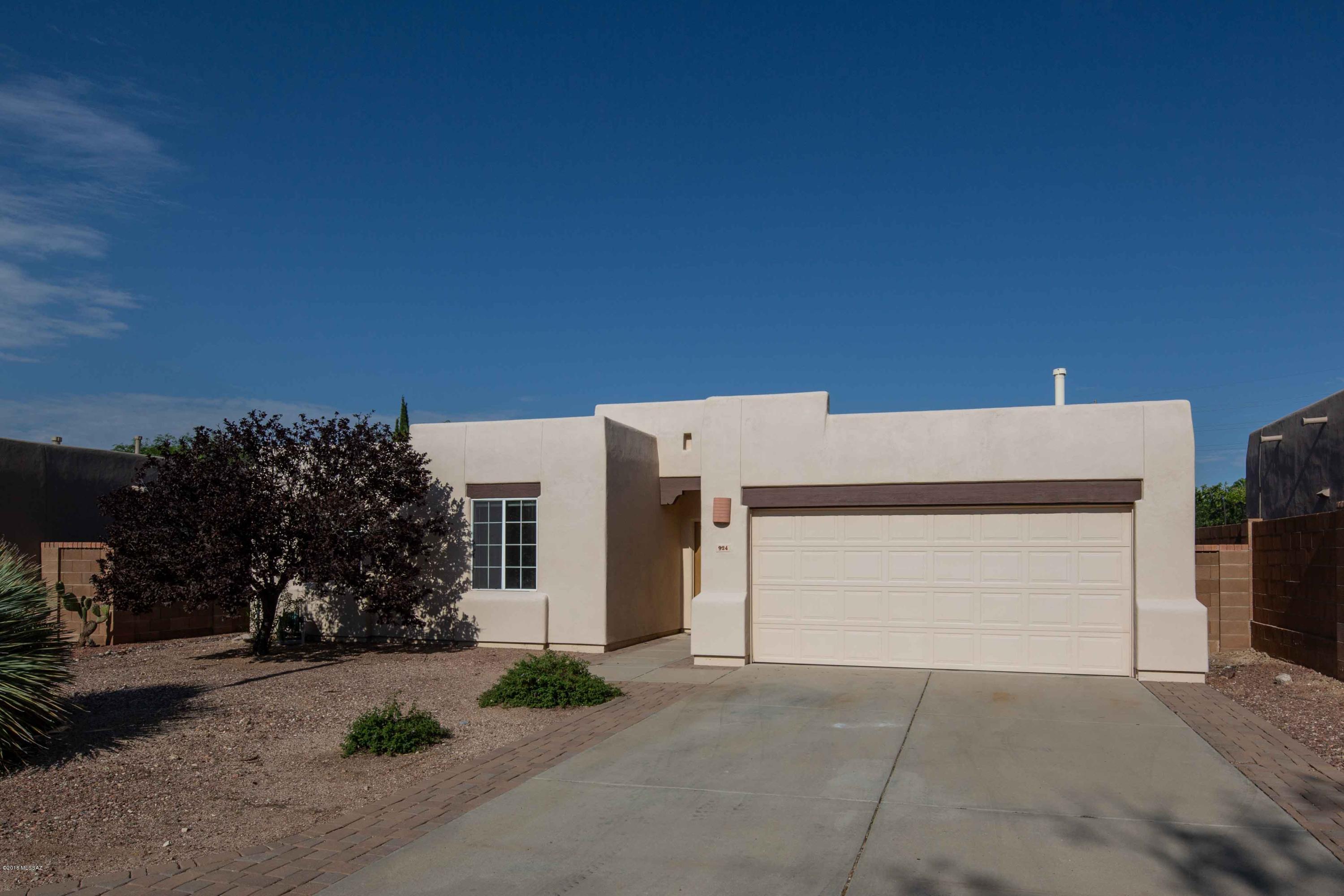 Beautiful 3 Bedroom Home in the Oro Valley Gated Community of the Villages of La Canada. This immaculate home is move-in ready with New Flooring, New Paint, New Countertops, and New Appliances and more! This home features a kitchen with granite countertops, stainless appliances and pantry. Large family room and breakfast area. Large master bedroom with walk-in closet and an on-suite master bath. Good sized guest bedrooms. Low Maintenance Backyard has covered patio, mature fruit tree and is perfect for entertaining and gatherings. All Poly has been replaced! Community has a guard on duty, walking trails, children's play park and lighted streets. Close to recreation, shops and services!