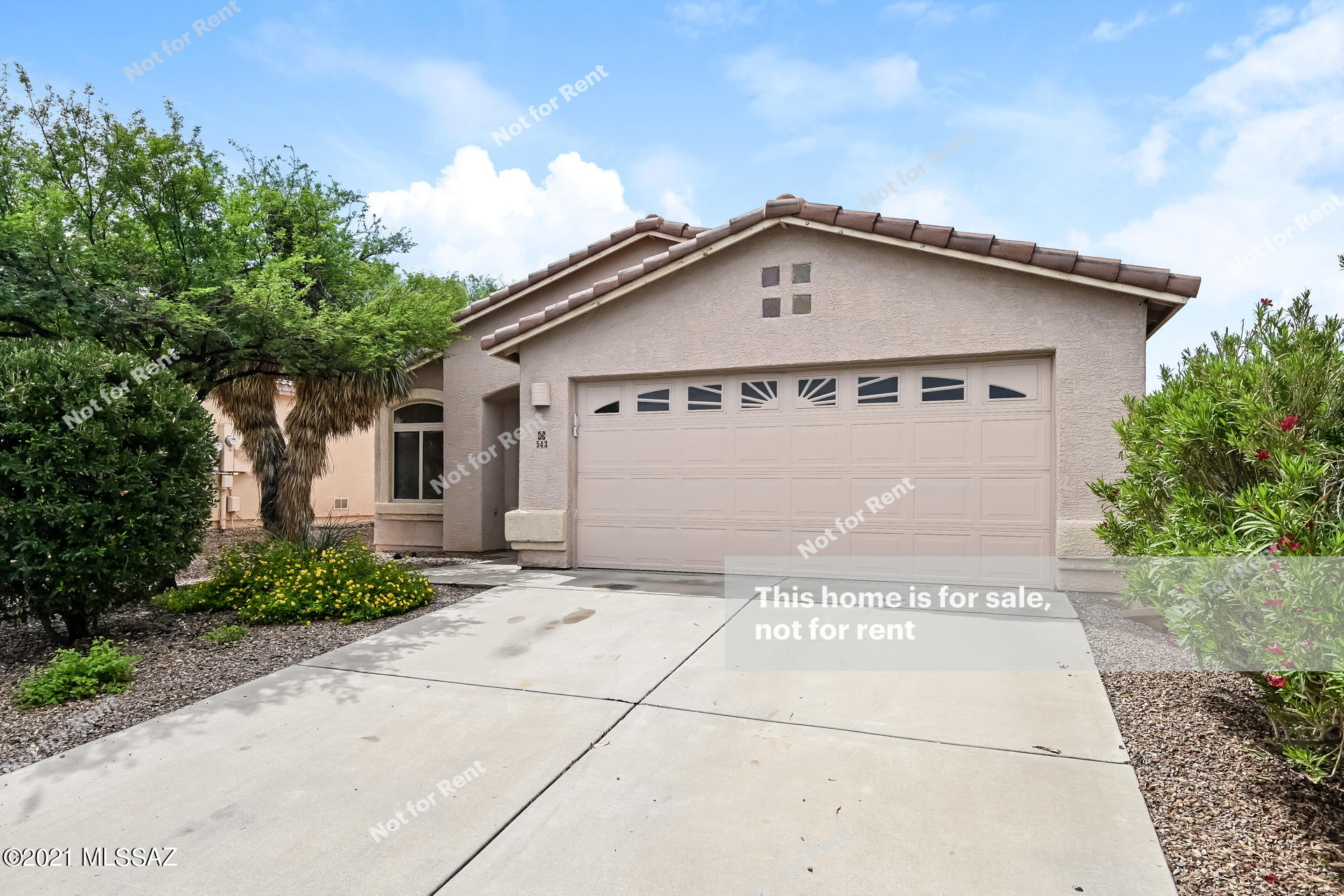 This Tucson one-story home offers a patio, and a two-car garage.