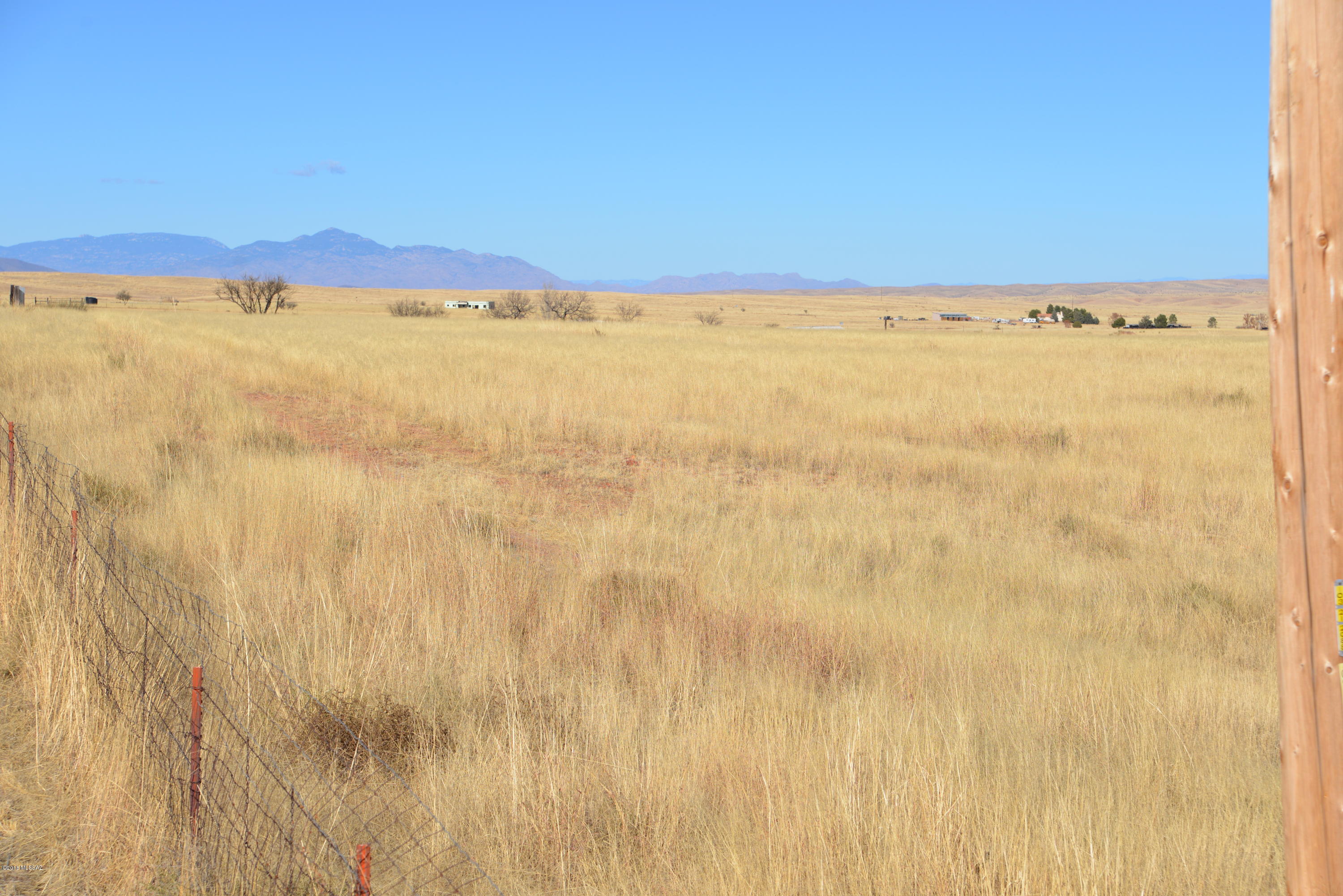 This is a terrific value for a full 10.0 acre parcel complete with a capped high output well.  The terrain is gently sloping to the SE, with most of the ground buildable, but for a tiny portion in the SE corner which is low.  There is some electrical infrastructure in place and power is fairly close to the lot. This parcel presents lovely views from the high ground and could make a choice homesite in a convenient location, or possibly a wine-related use given the paved frontage on Highway 83.