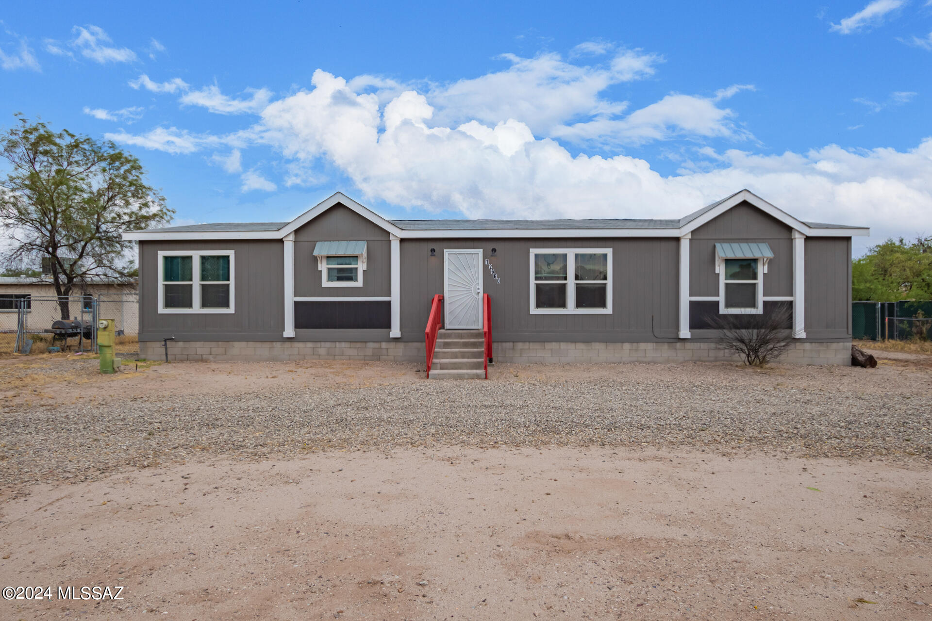 *Range Price* $300k-$350k. The seller will accept, or counter offers in this range.  Be excited to see this immaculate manufactured home with a circular driveway now available! Come inside to find a generous living room, tall ceilings with exposed beams, ceiling fans, and fresh paint complemented by wood-style vinyl flooring. The eat-in kitchen is a homemaker's dream, designed with built-in appliances, granite counters, recessed & pendant lighting, a plethora of white cabinetry with crown molding, and a prep island with a breakfast bar. The primary retreat has a designer's palette, plush carpeting, a private bathroom with dual sinks, a vanity space, and a walk-in closet. Continue onto the expansive backyard, offering a fire pit and a generously sized area for your RVs and toys. Hurry!