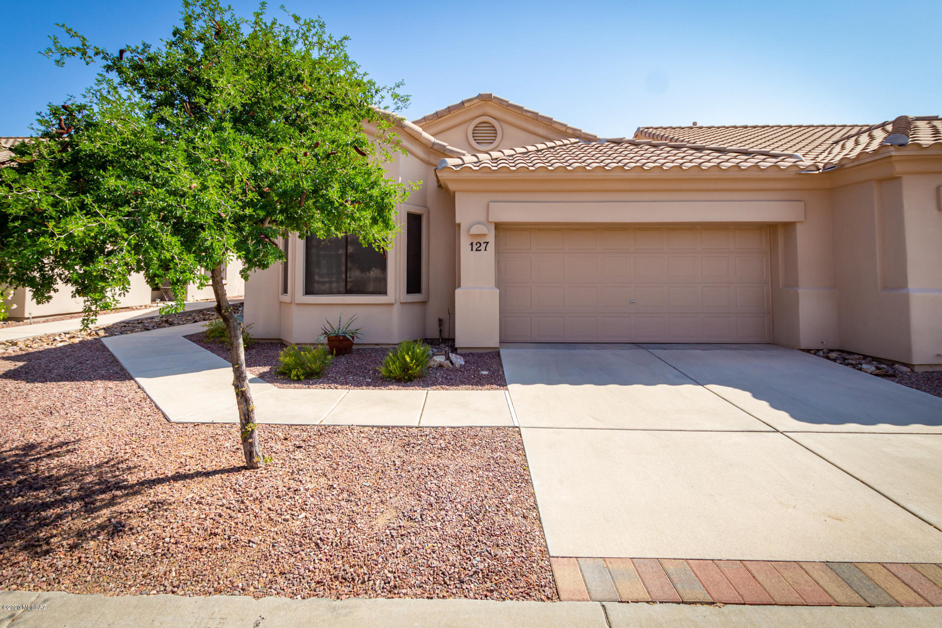 This outstanding home is located in the desirable gated community of Rancho Vistoso! This home boasts dramatic vaulted ceilings, a soothing color palette, window blinds, ceiling fans, plush carpet, a spacious kitchen pantry, and a formal dining area ideal for hosting guests. Throughout this house, pride of ownership and careful maintenance is evident. The kitchen has stylish counters and plenty of wood cabinets for storage, as well as a built-in breakfast bar to enjoy a meal at. The interior laundry room provides ample storage space with cabinets. This home has 2 generous-sized bedrooms with plenty of closet space and 2 pristine bathrooms. Walk through your sliding glass door to your backyard covered patio and soak up the inviting Tucson sun. Extend the festivities from your own home to all the wonderful amenities including a community pool, a phenomenal lap pool, a play and lounging area, a hot tub, a library, a billiards room, and full community kitchen. The HOA does termite treatments every 5 years, but offer the services at any time, as well as roof inspections and maintenance, cable and satellite, water, garbage collection, street maintenance, and more. Make this your new relaxing oasis today! Schedule an appointment to view!