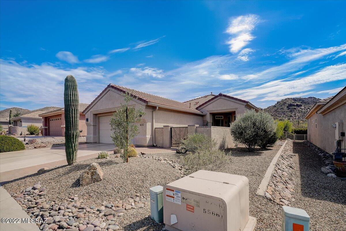 Looking for the perfect home that has both desert mountain VIEWS and city lights? Look no further. This extended keystone model home includes not only a bigger living room but also an extended second bedroom and garage space for a golf cart or workspace. The home has been upgraded throughout including the kitchen, bathrooms, and a new AC. List of upgrades will be provided. Don't miss this one today!